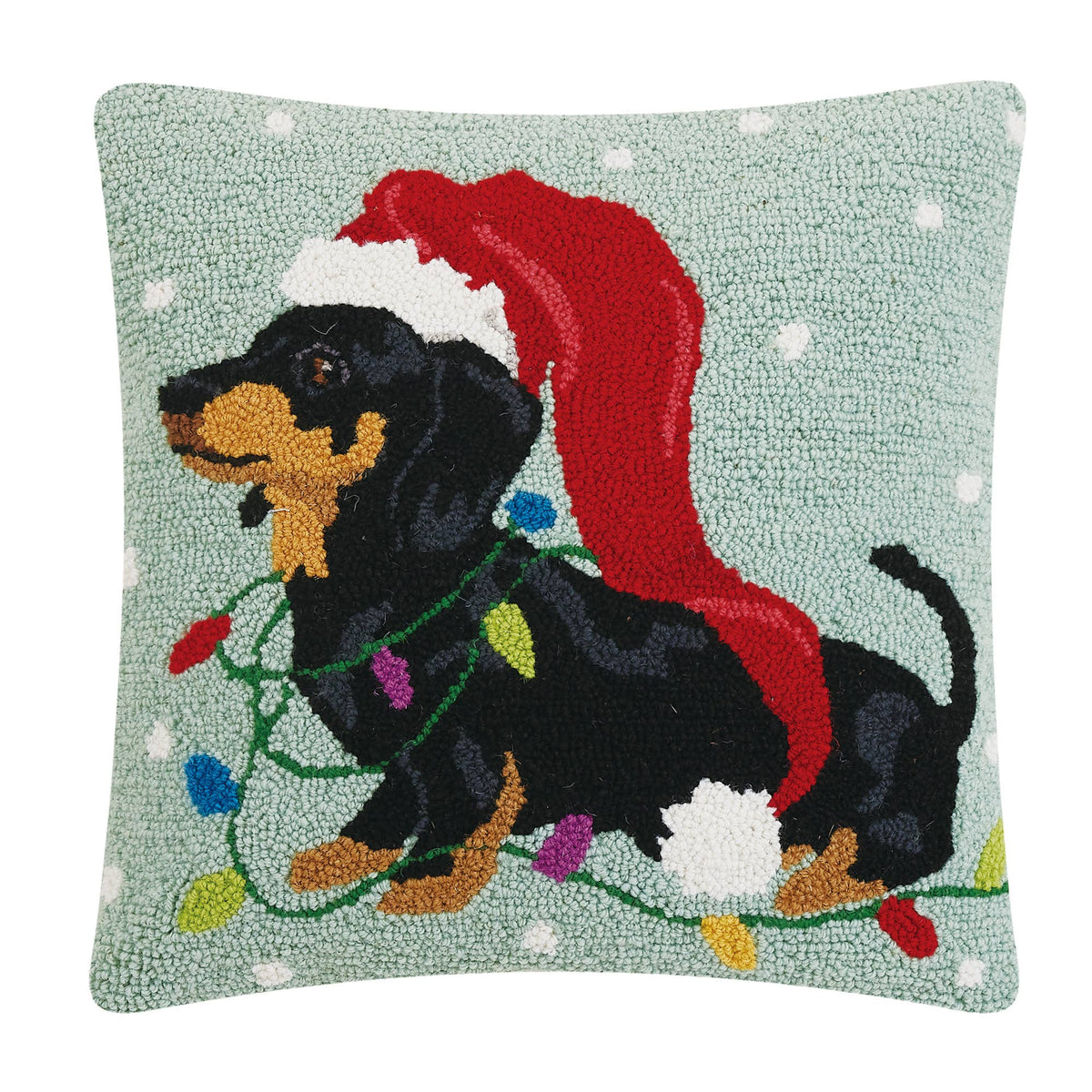 Hooked wool pillow of a dachshund in a long Christmas hat, original product photo