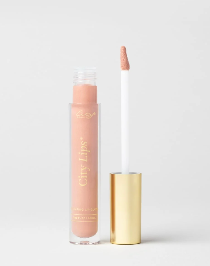 City Lips plumping lip gloss in Tokyo Kiss, a sheer cool-nude shade