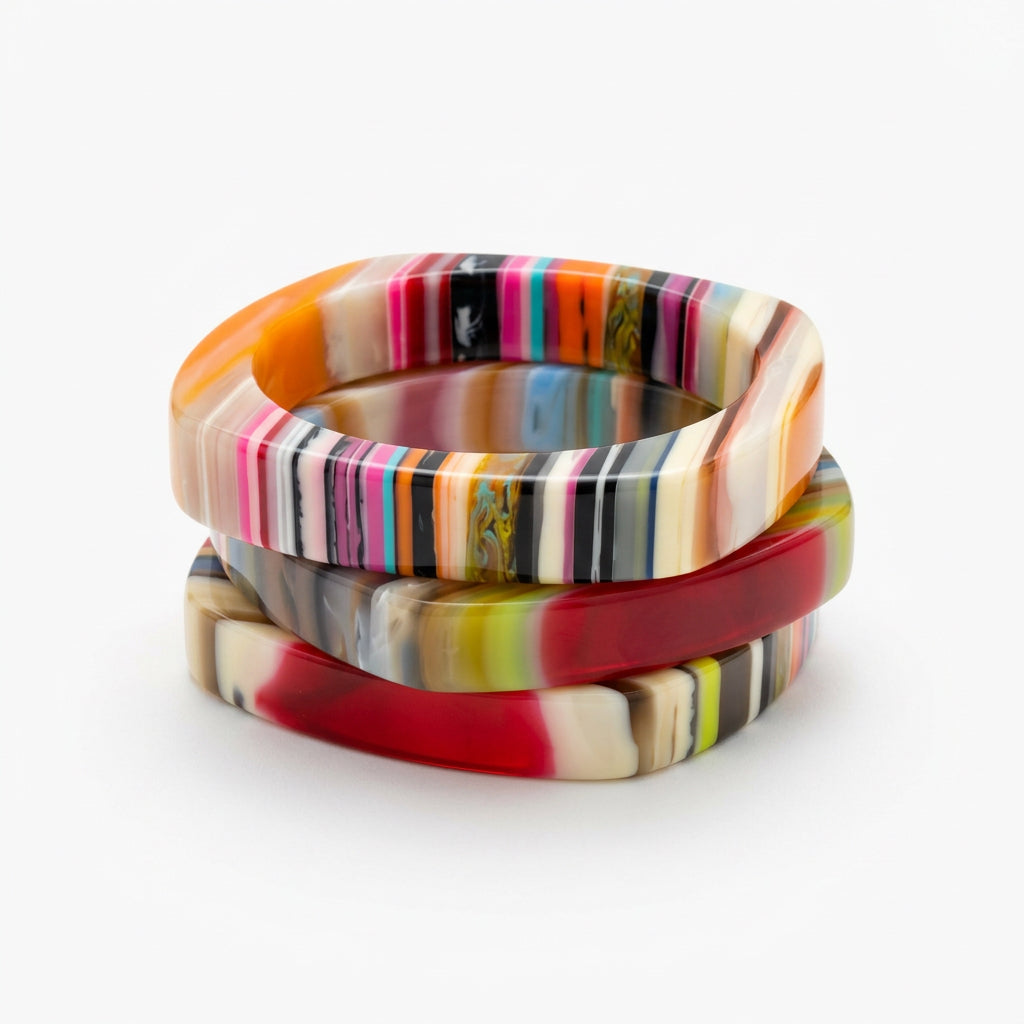 Square multicolor resin bangle bracelets in orange, pink, red and olive stripes, stacked view.