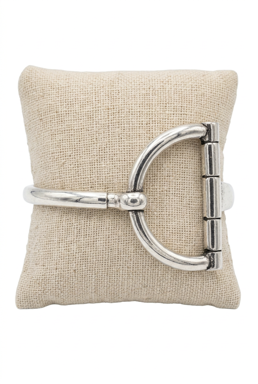 Accessories to Go Large Stretch Horse Bit Bracelet in silver tone on a linen pillow