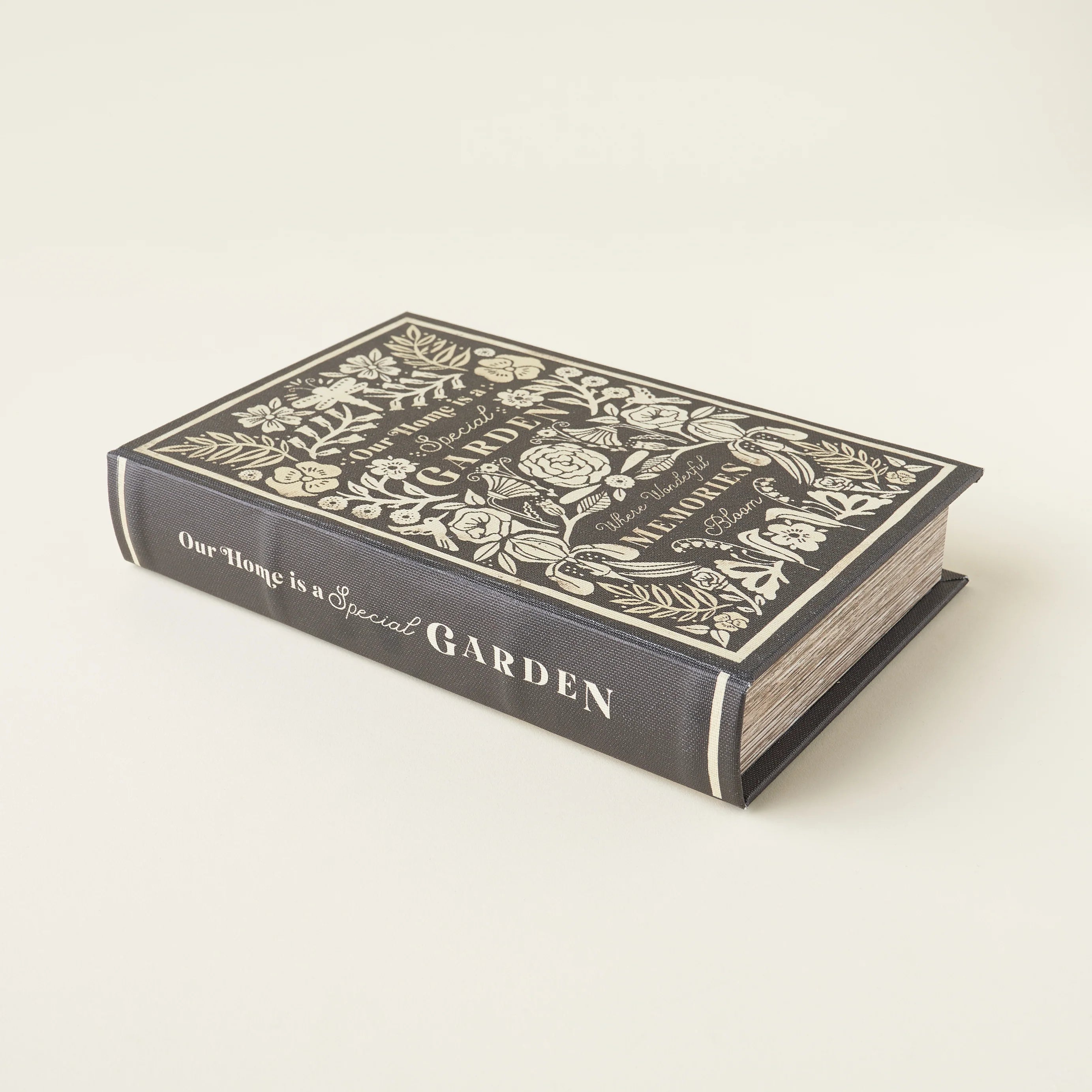 Decorative book with floral design and text on a white background