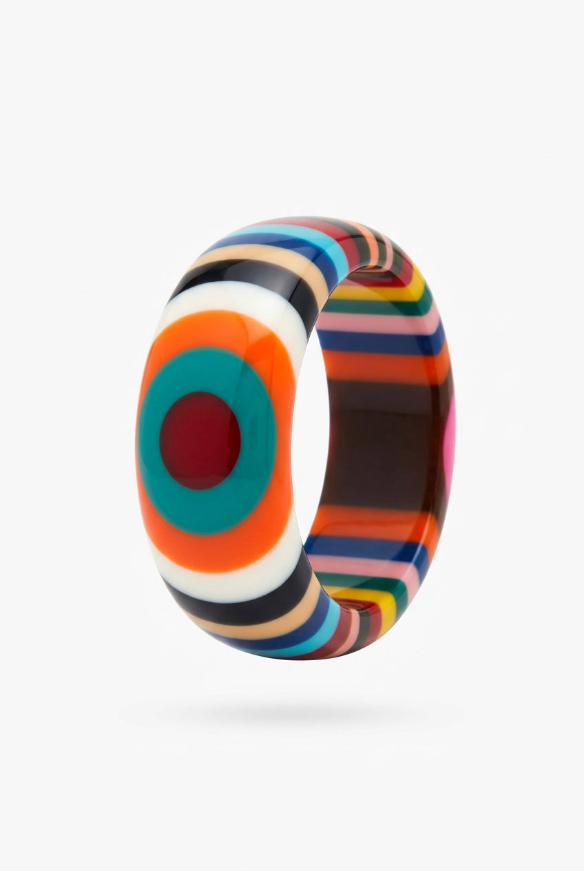 Multicolor striped resin bangle bracelet with orange, teal and red concentric oval motif, side view.