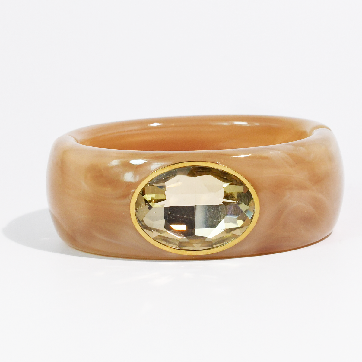 Caramel marbled resin cuff bracelet with faceted champagne oval stone in gold-tone setting