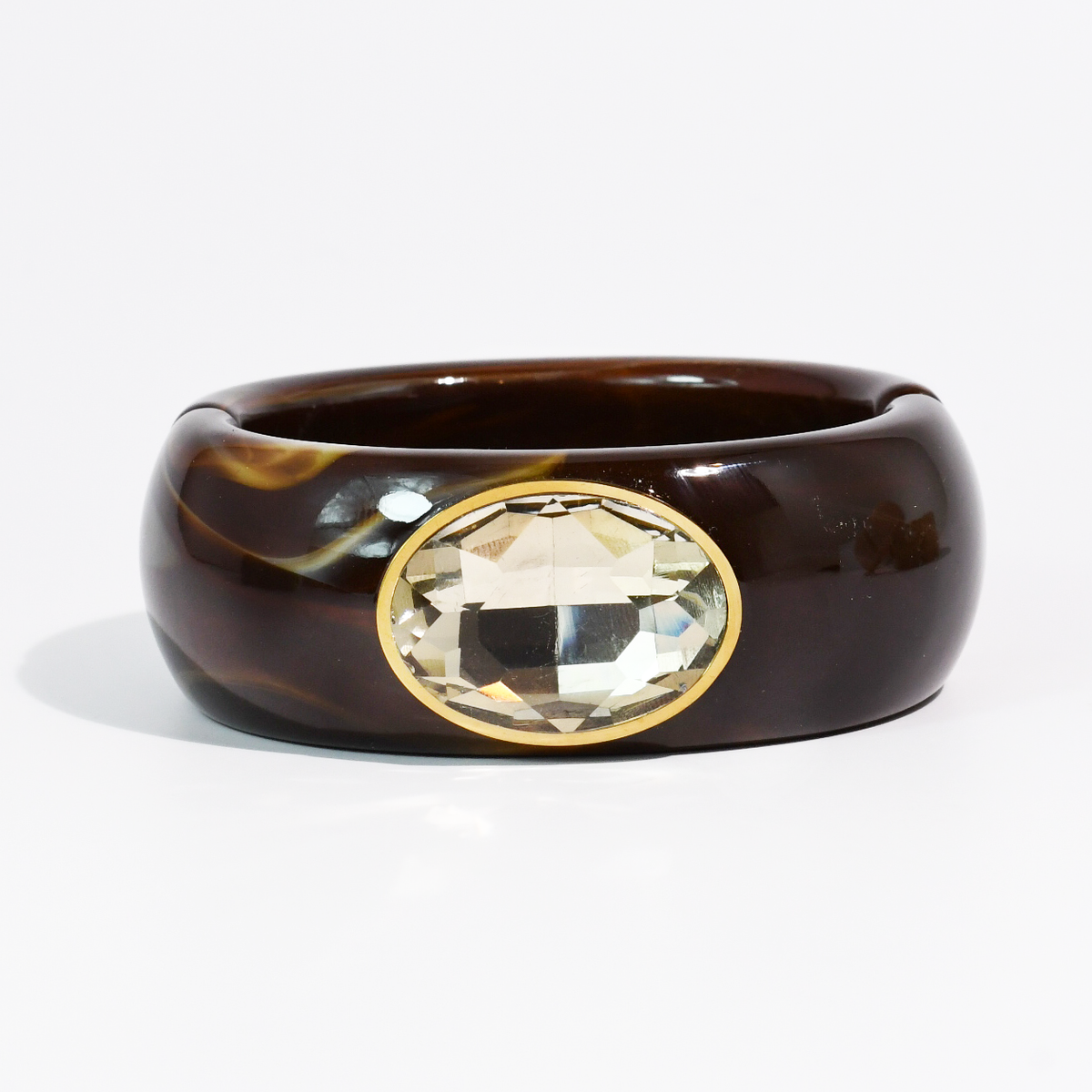 Dark chocolate brown resin cuff bracelet with faceted champagne oval stone in gold-tone setting