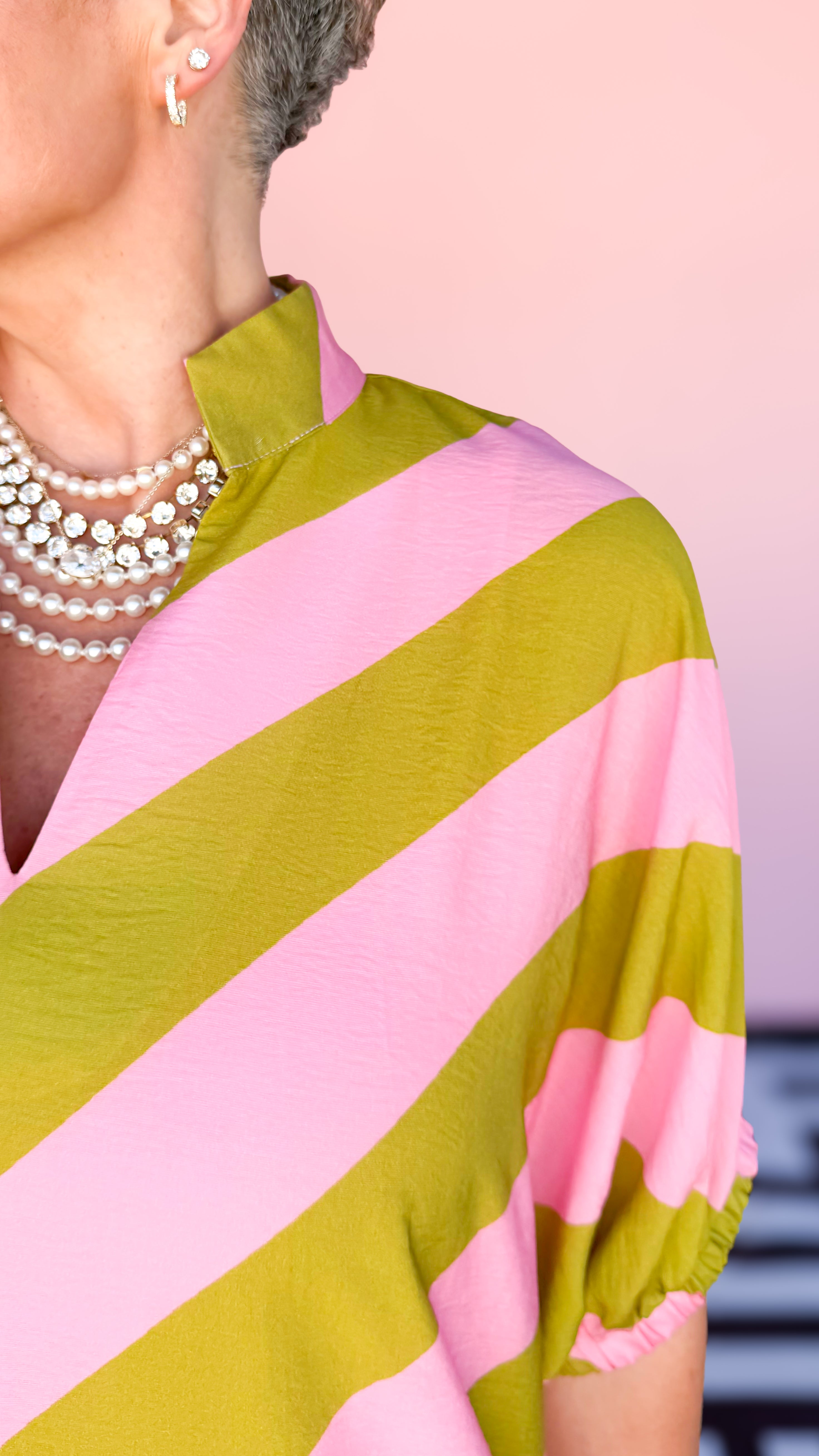 Kim diagonal stripe midi dress in pink and kiwi worn on model - styled view - BLVD Boutik