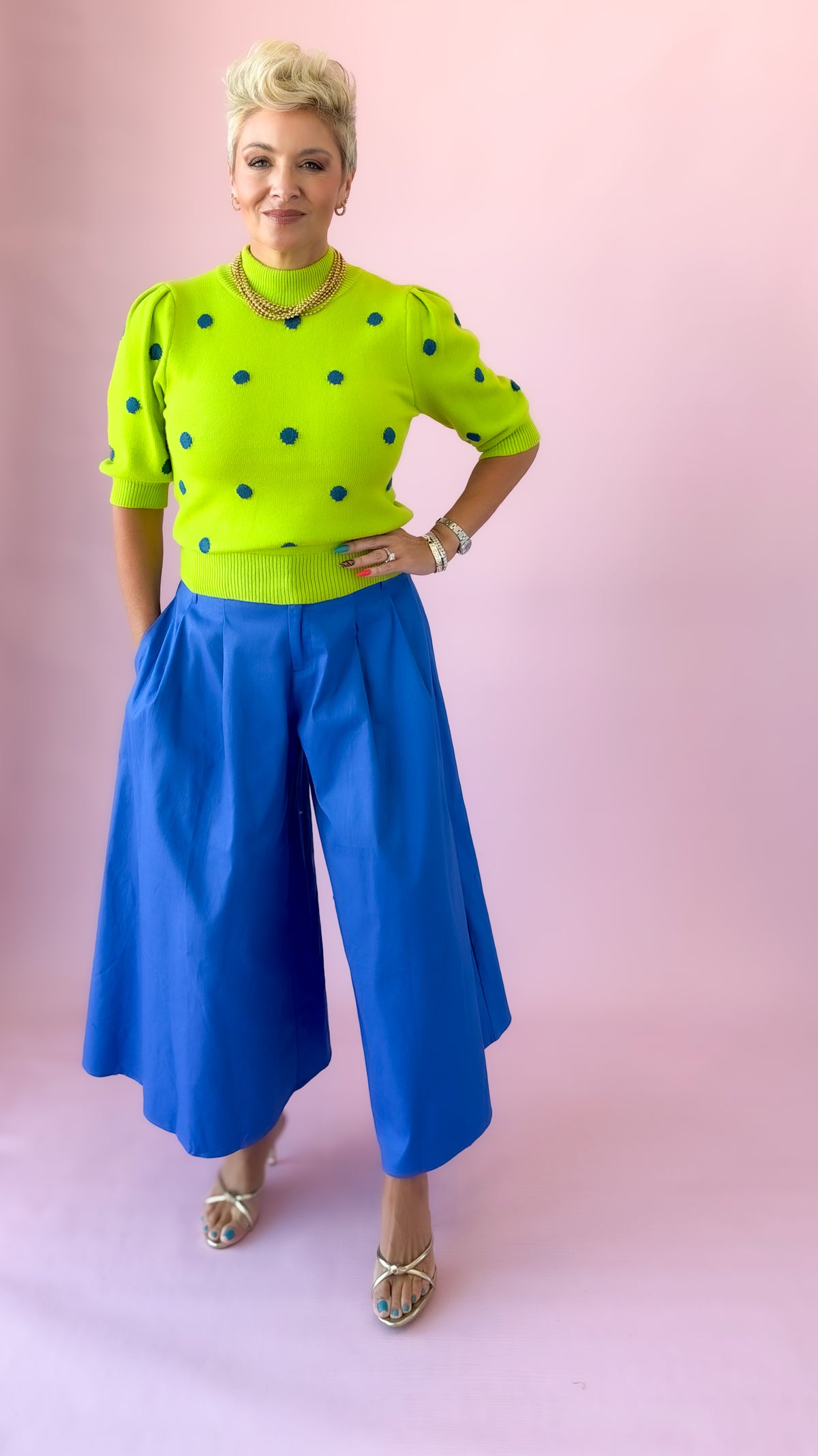 Lime and blue polka dot sweater styled with cobalt culottes, full length