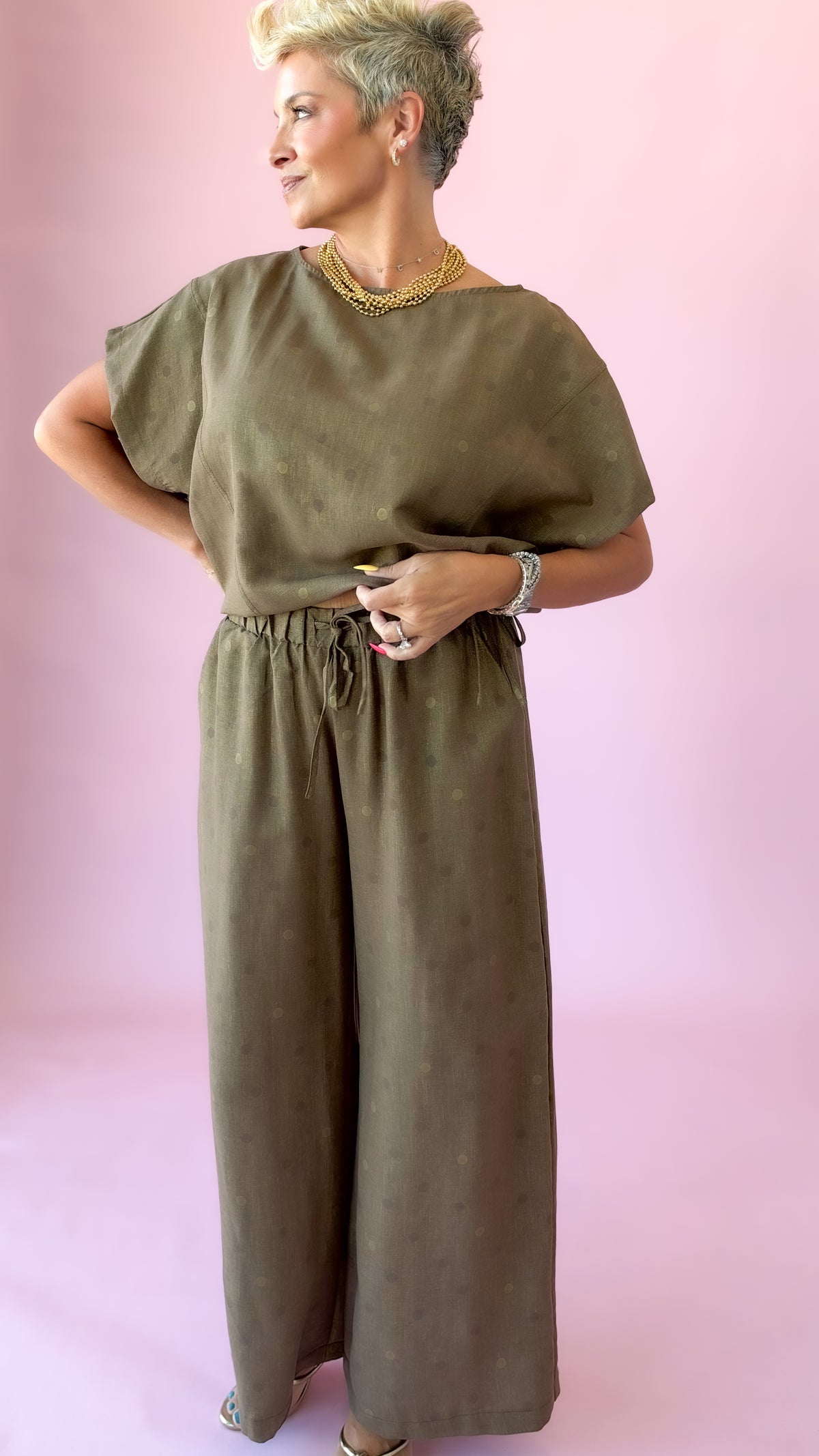 Brown wide-leg polka dot pants with matching short sleeve top, front view