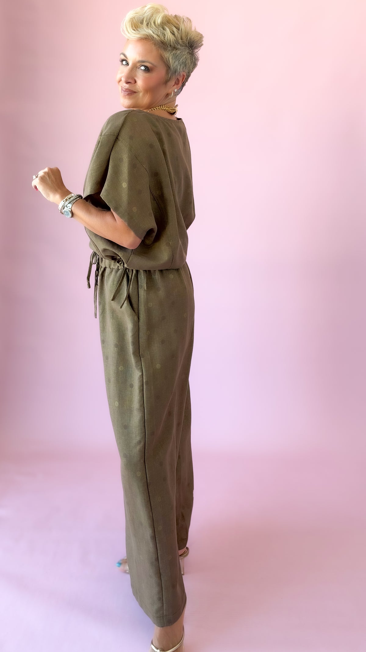 Side profile of brown wide-leg polka dot pants