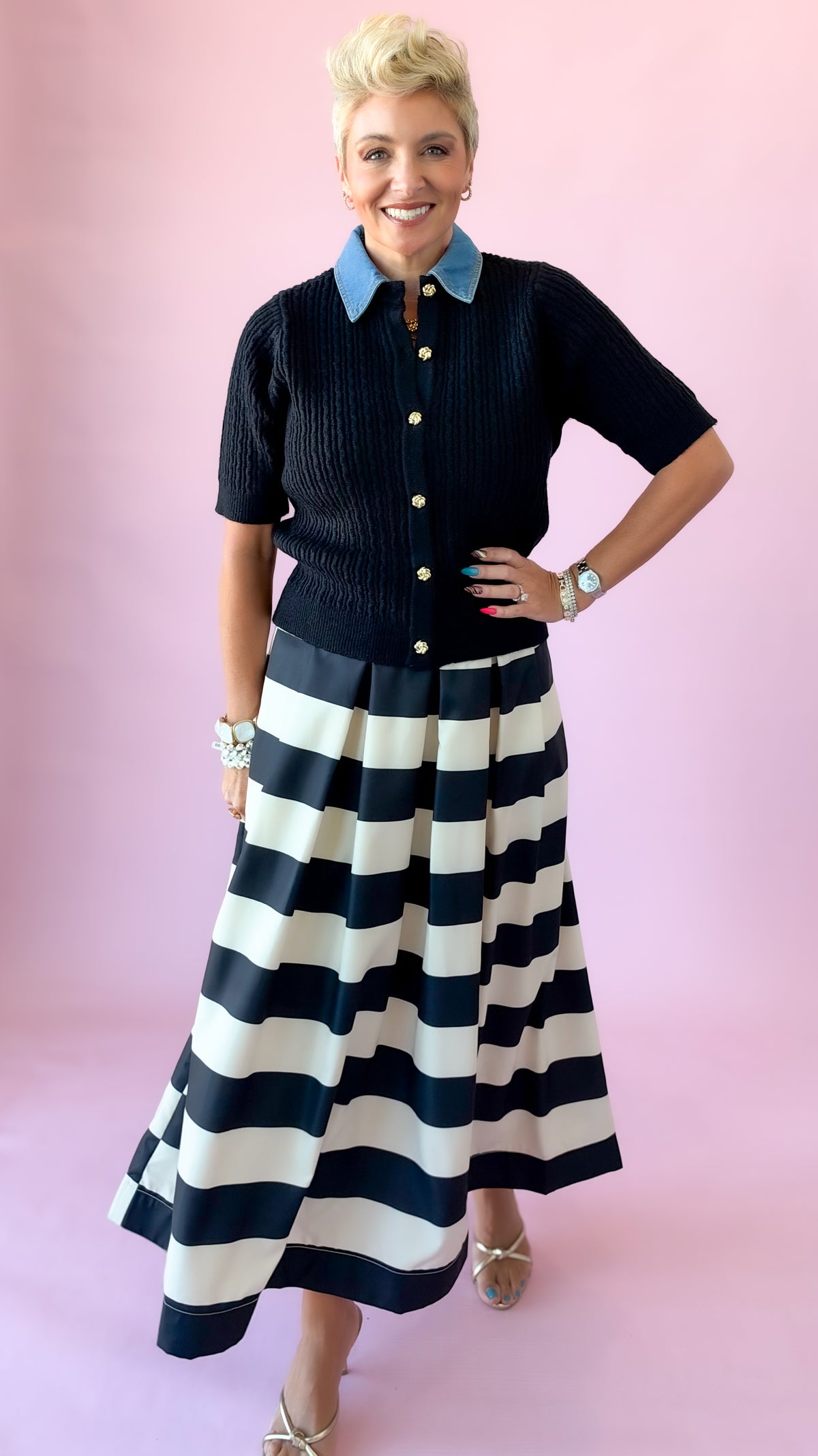 Black and white wide stripe pleated midi skirt styled with a black knit polo top