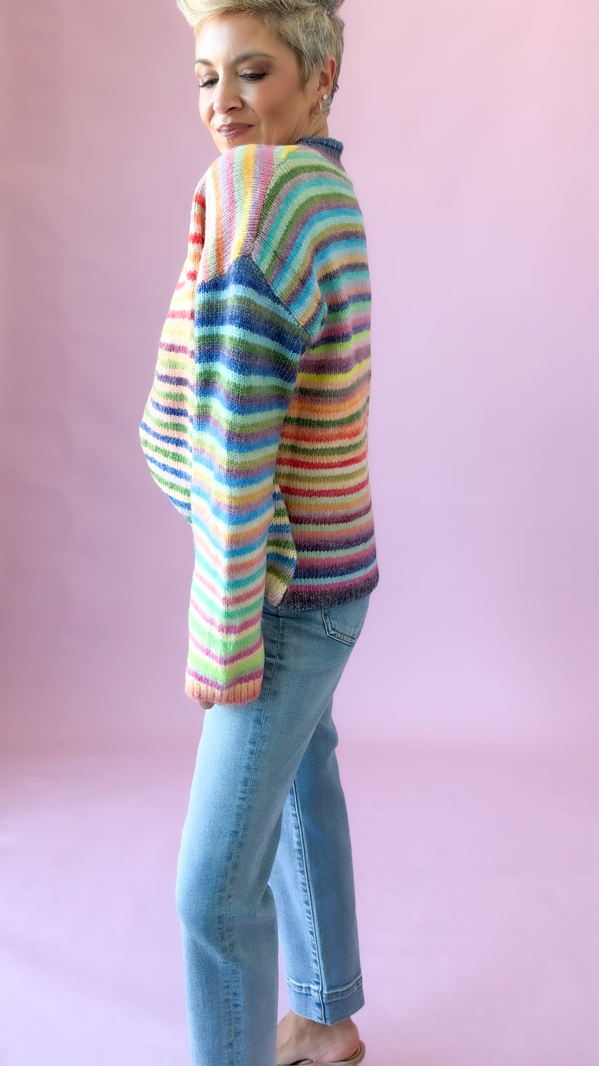 Side view of pastel rainbow stripe cardigan
