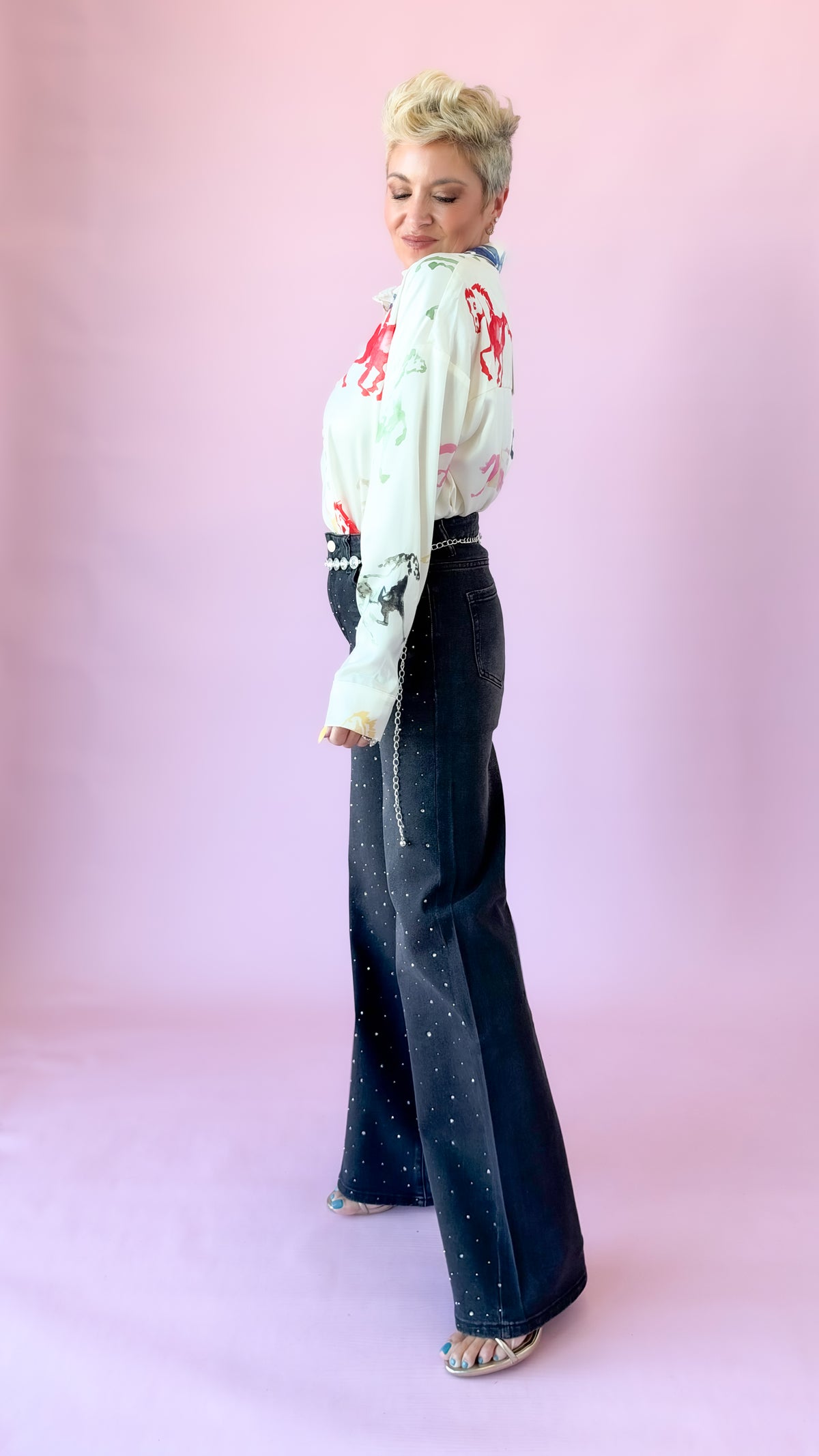 Side view of cream watercolor horse print button-up blouse