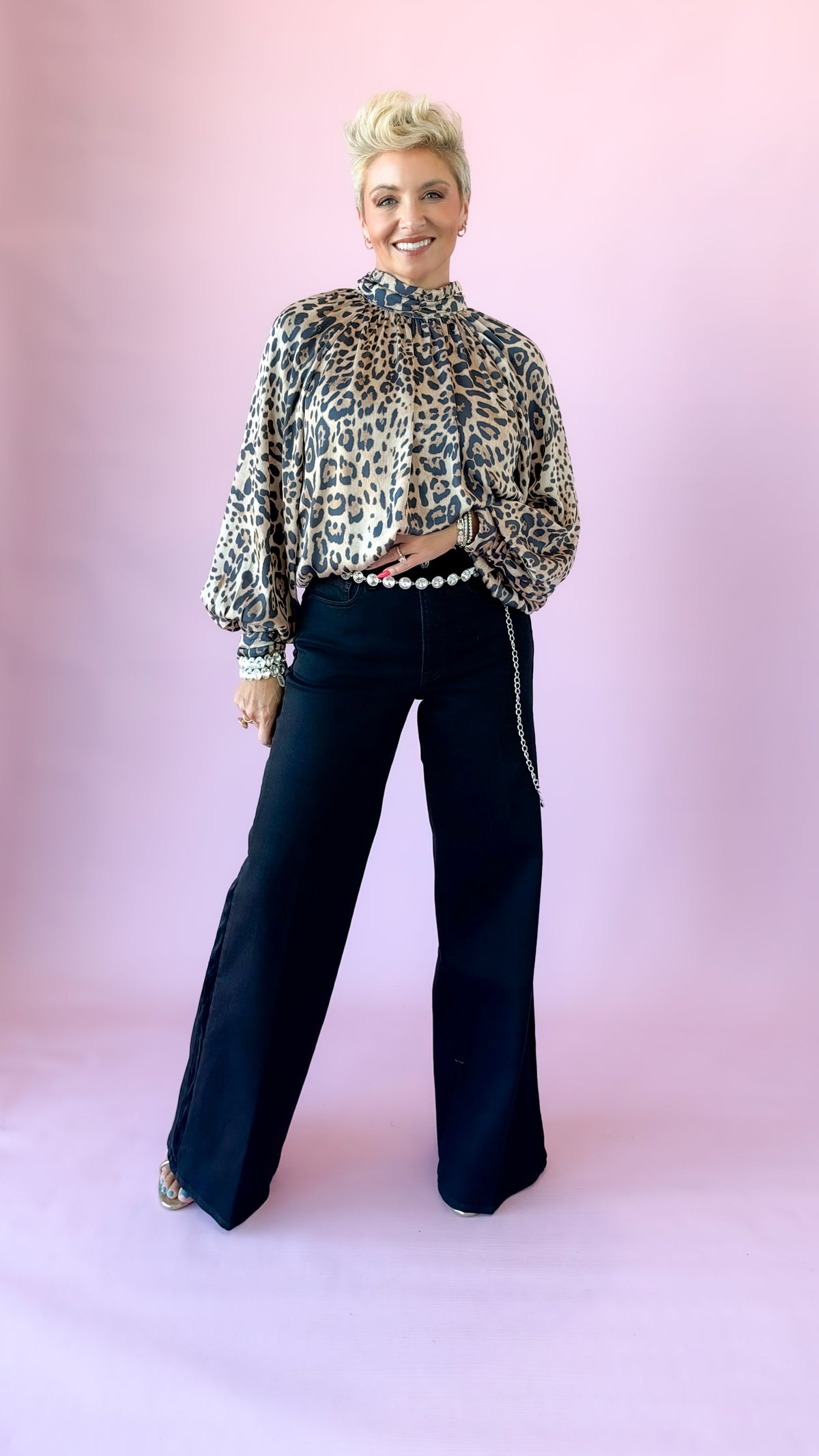 Jessie leopard print long sleeve top with black trousers, front view