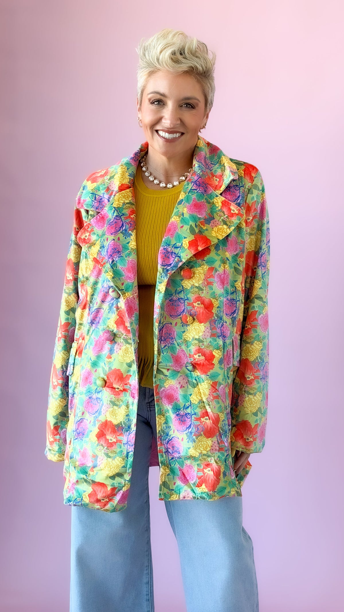 Oversized multicolor velvet floral blazer worn open over a mustard top and jeans