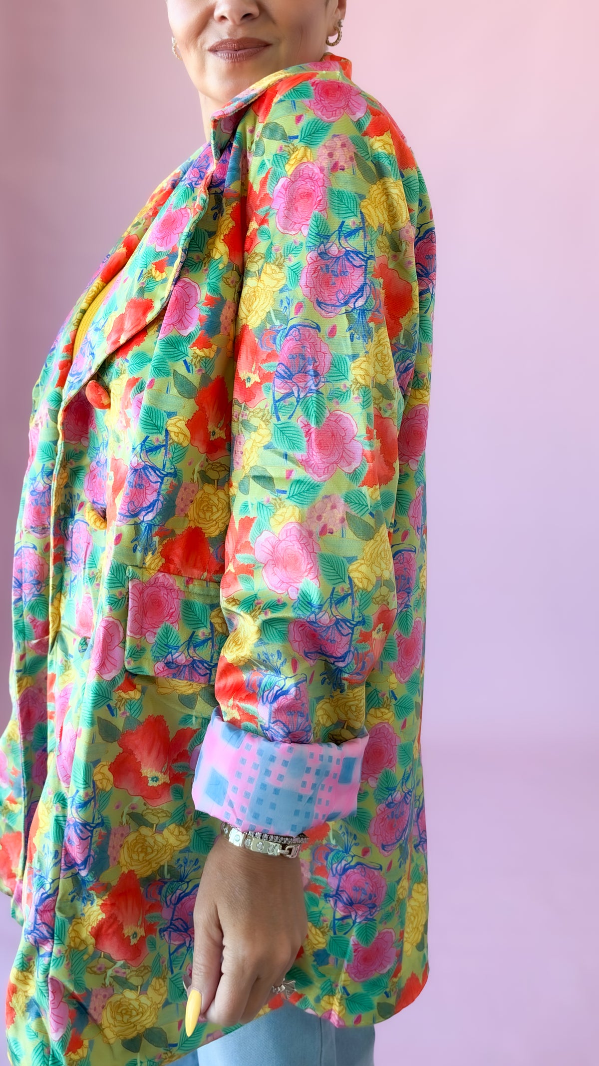 Side close-up of oversized floral velvet blazer with cuffed sleeves