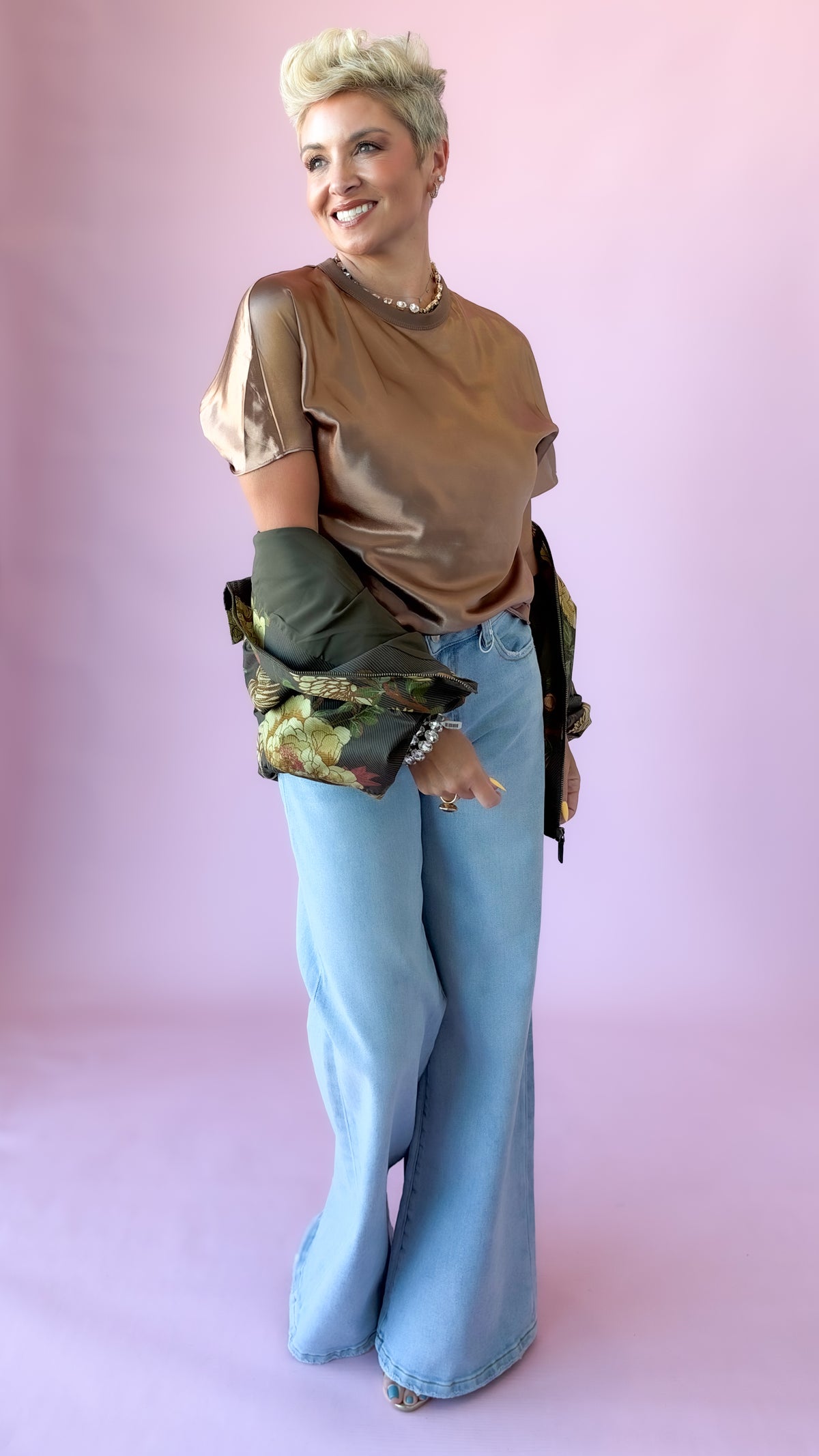 Full-length view of brown satin crewneck top with wide-leg jeans