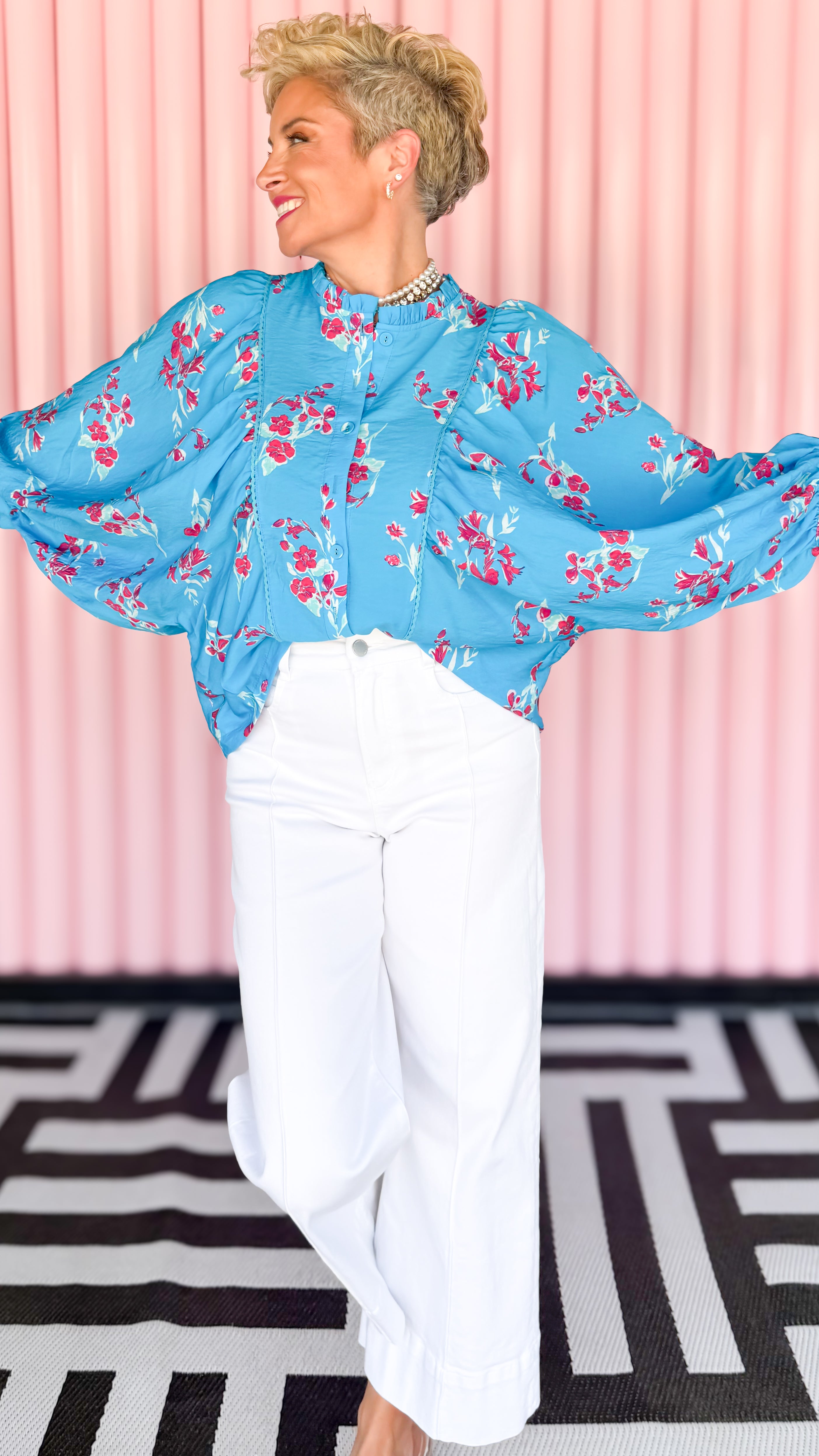 Dolman sleeve floral blouse worn on model - side view - BLVD Boutik