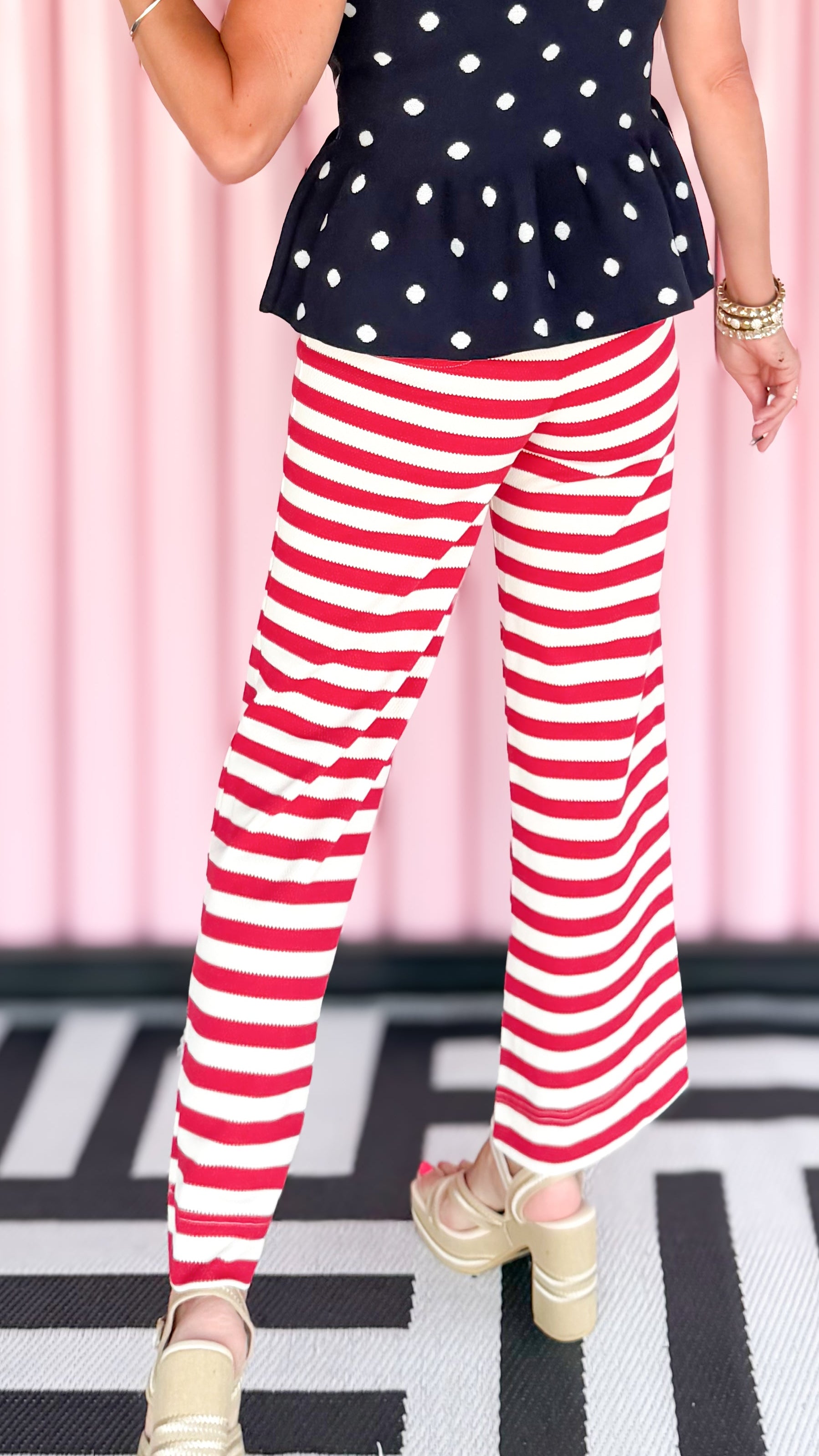 Stretchy striped wide leg pants in red worn on model - styled view - BLVD Boutik