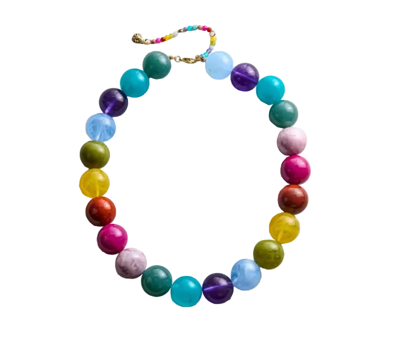 Colorful beaded necklace on a light gray background