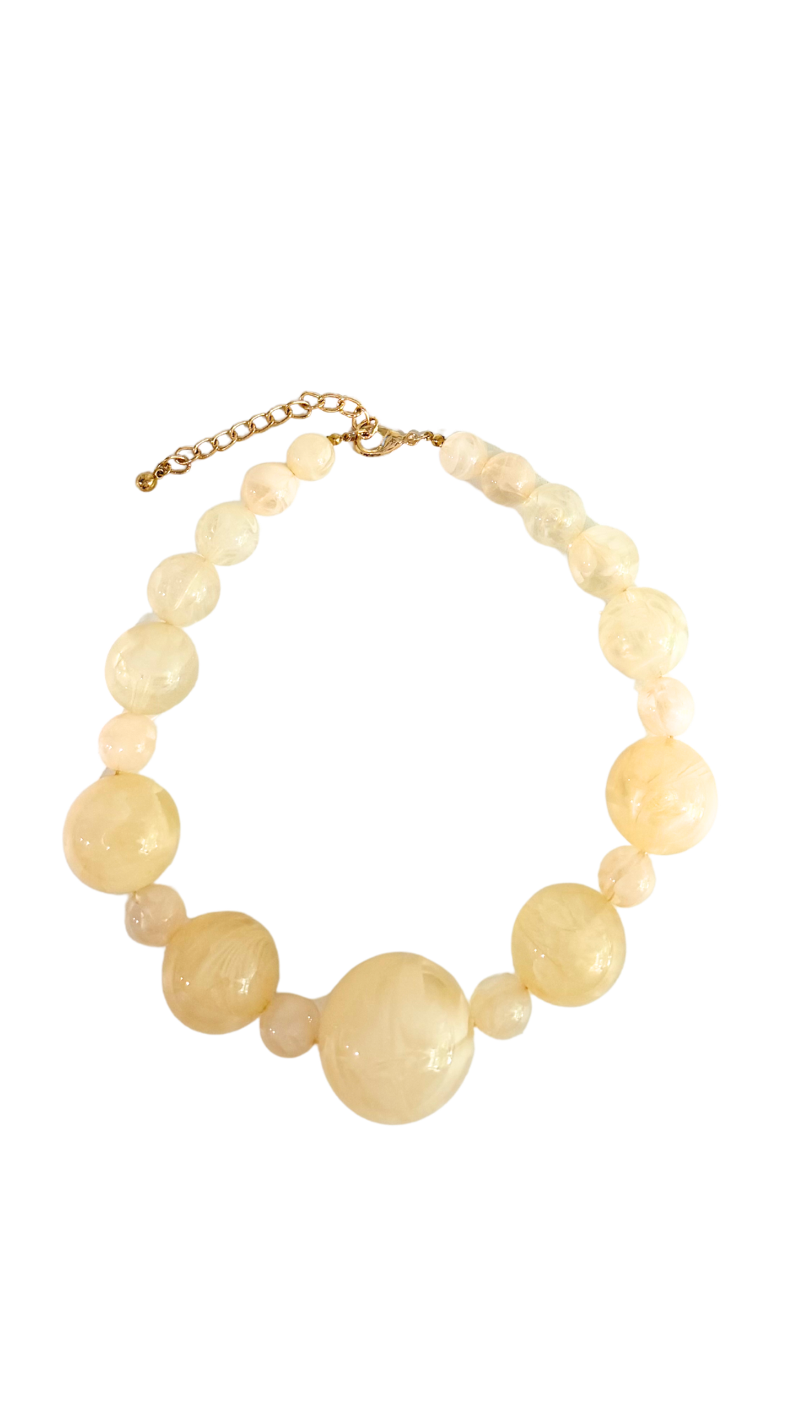 Necklace with large yellow beads on a white background