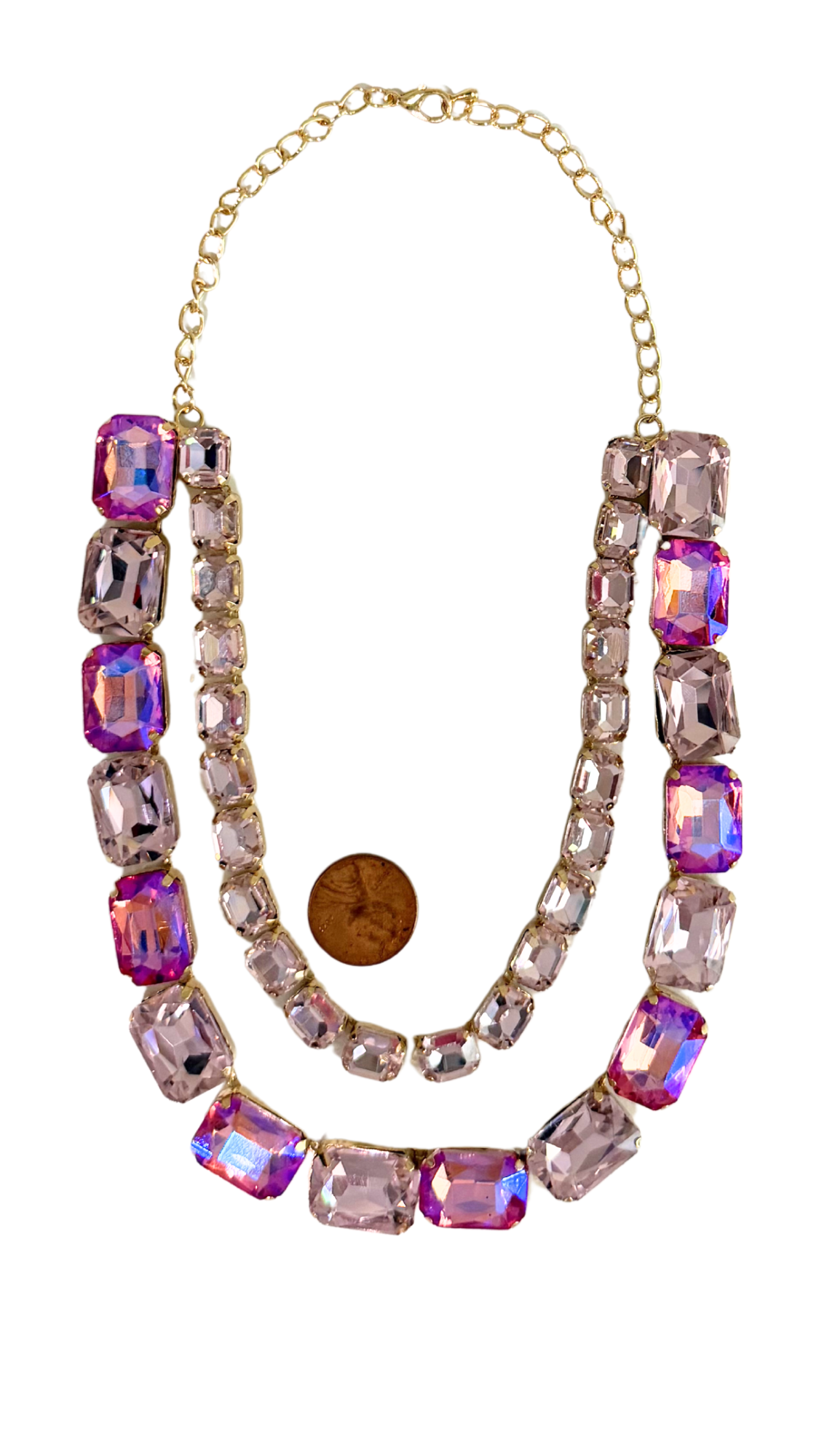 Necklace with pink and purple gemstones on a white background