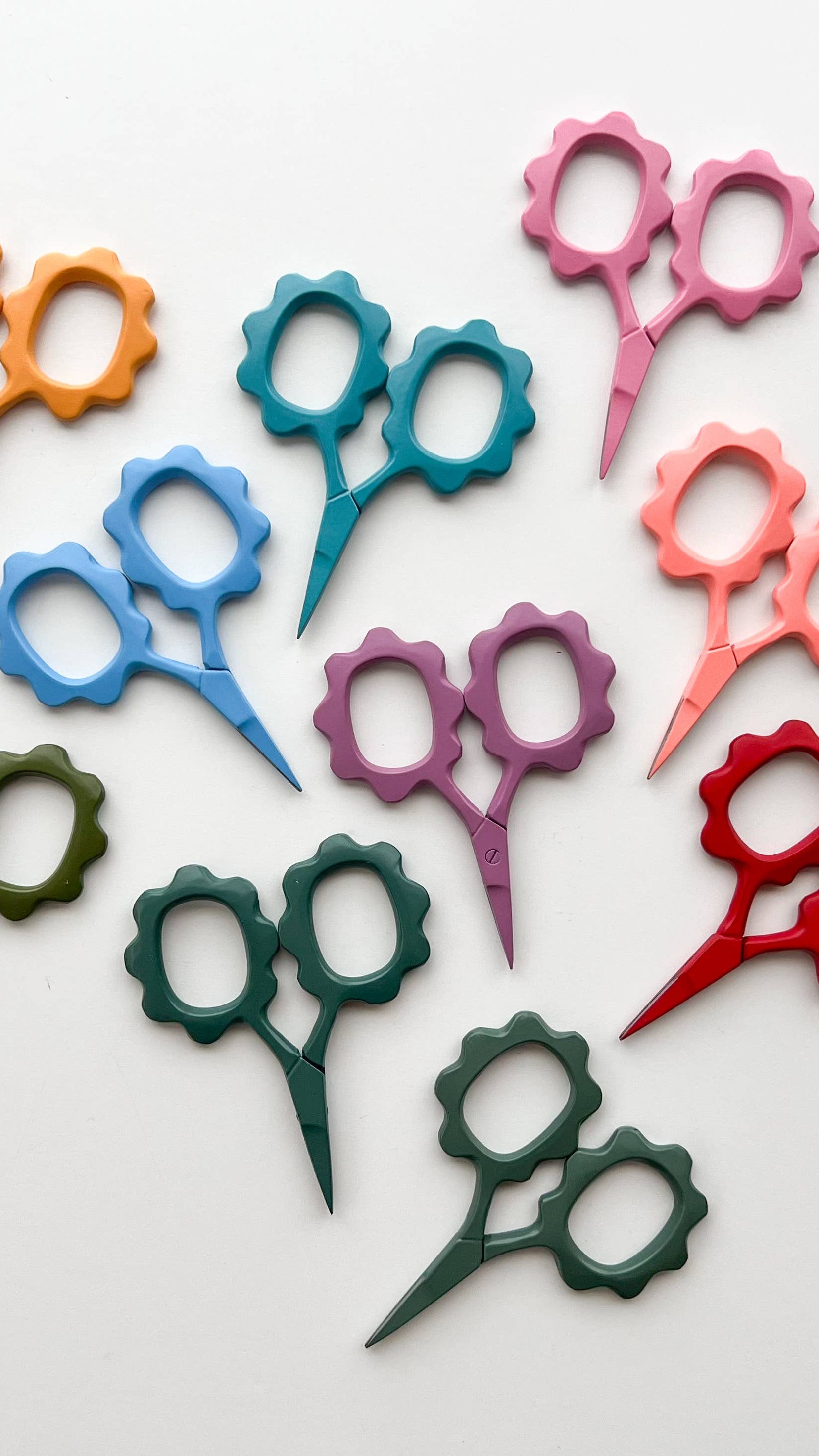 Colorful pair of scissors on a white background