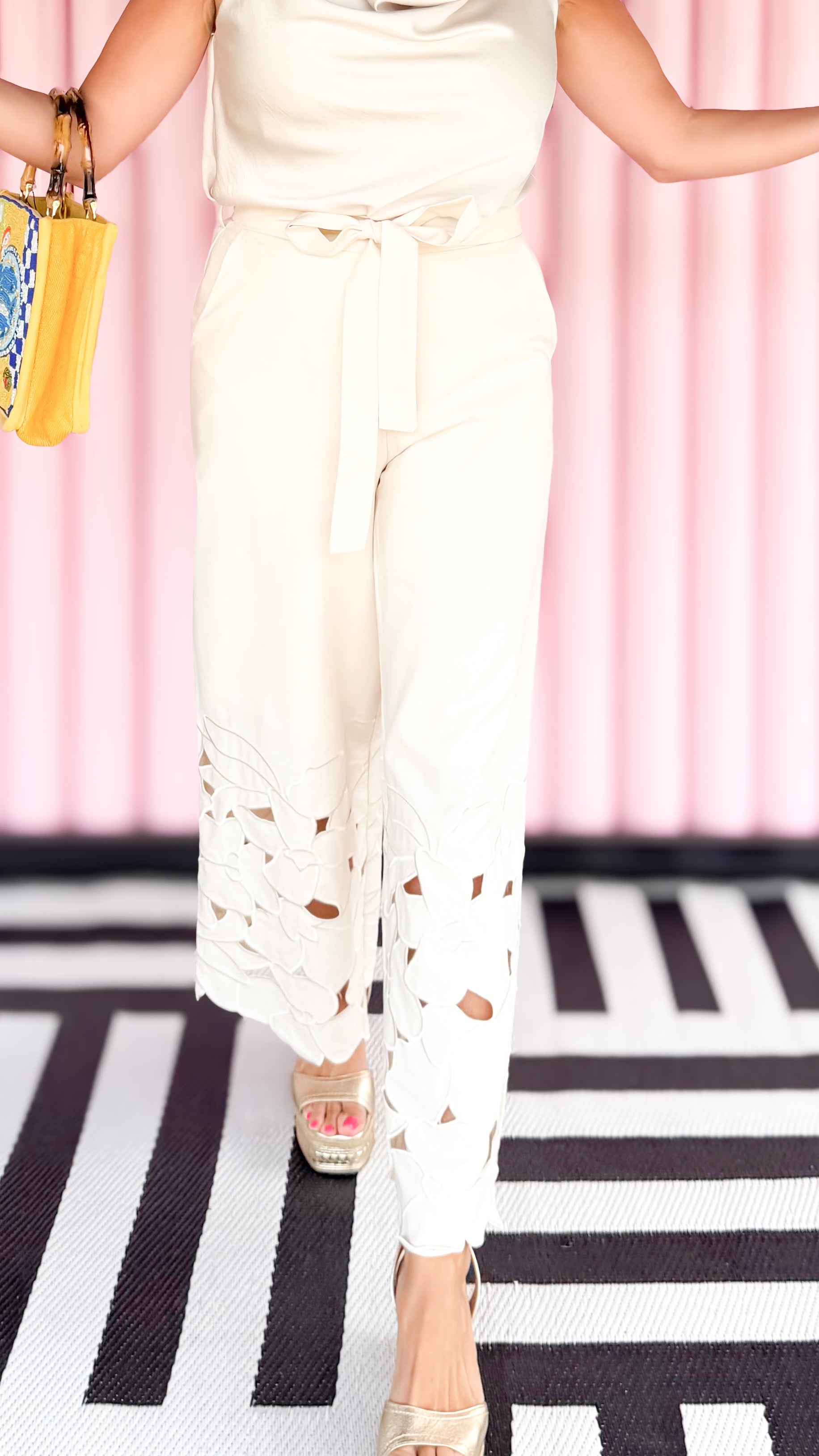 Bottom embroidery linen pants in cream worn on model - front view - BLVD Boutik