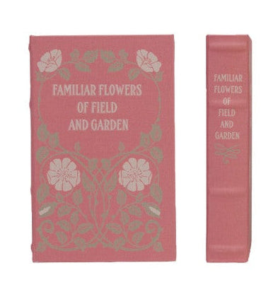 Collection of decorative books with various designs on a white background