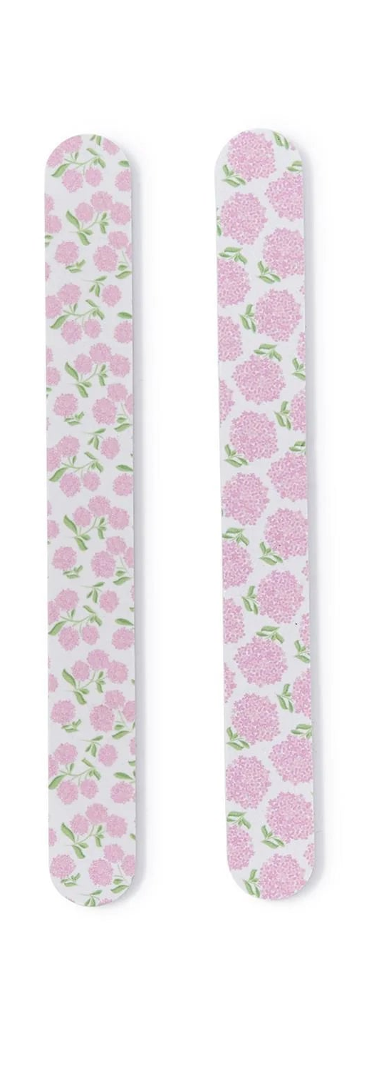 Four floral-patterned nail files on a white background