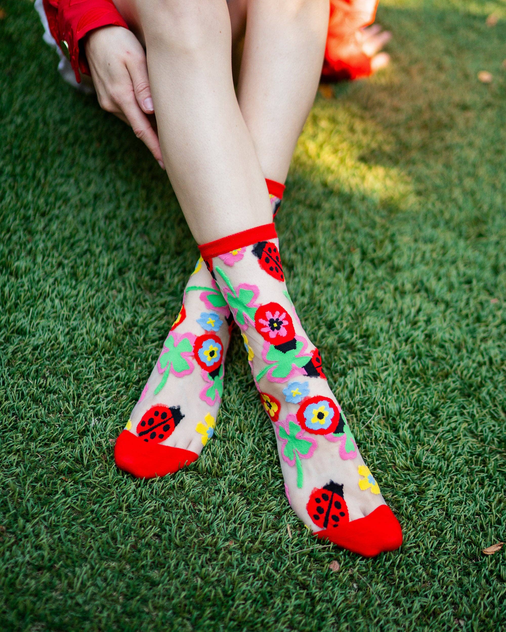 Lucky Ladybug sheer crew sock product photo - lifestyle view - BLVD Boutik