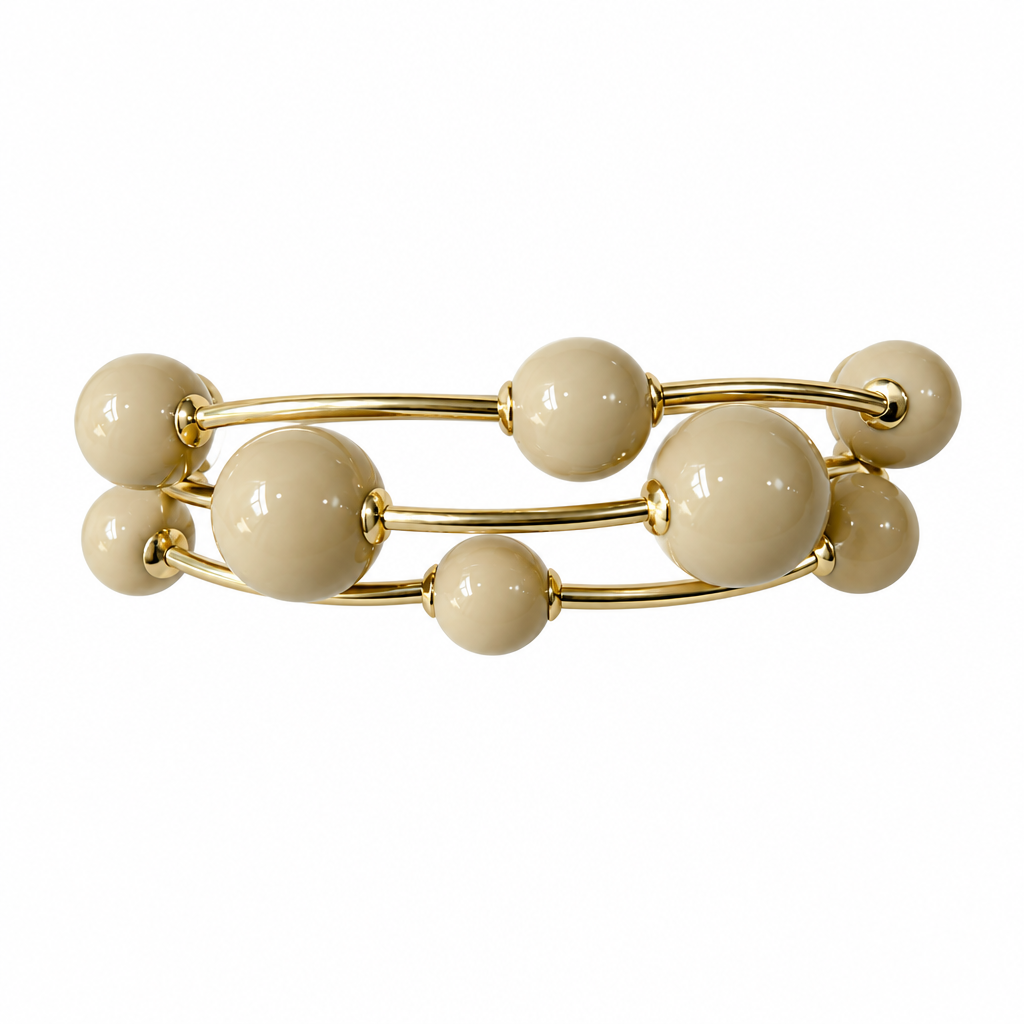 Cream three-strand bracelet on solid white, no display pillow