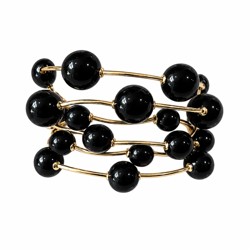 Black six-strand bracelet alone on solid white