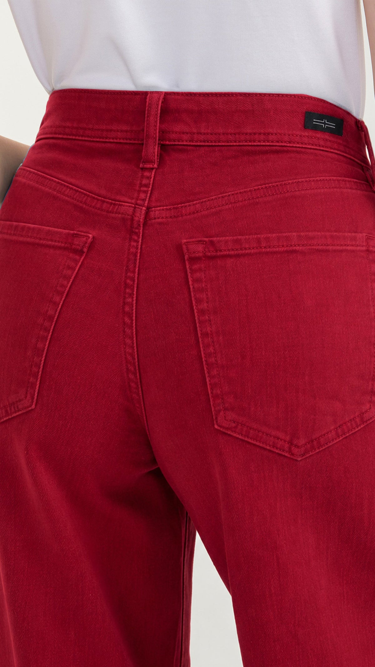 Close-up of back pockets on wild cranberry Hannah flare jeans