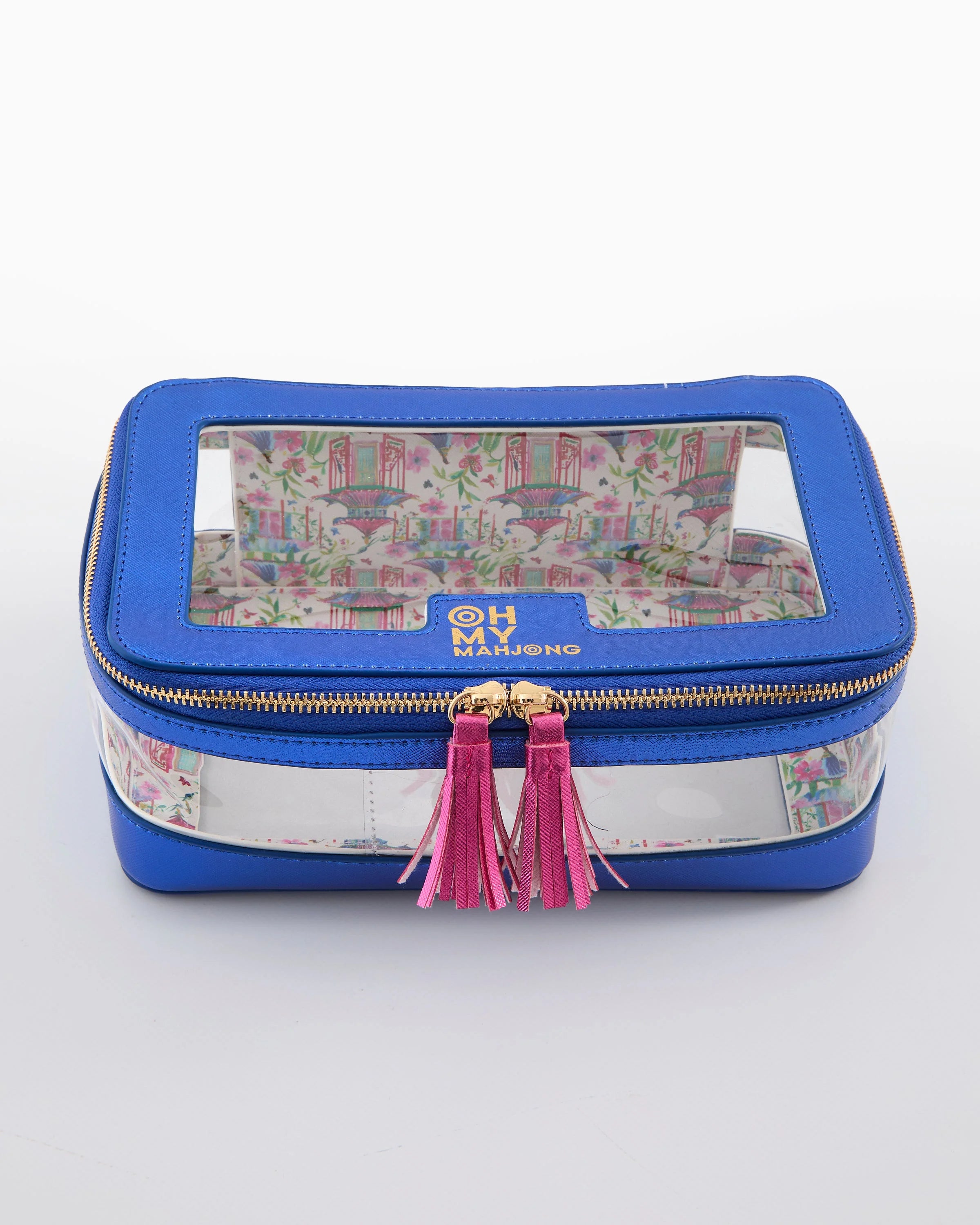 Blue jewelry box with floral patterned interior and pink tassels on a white background