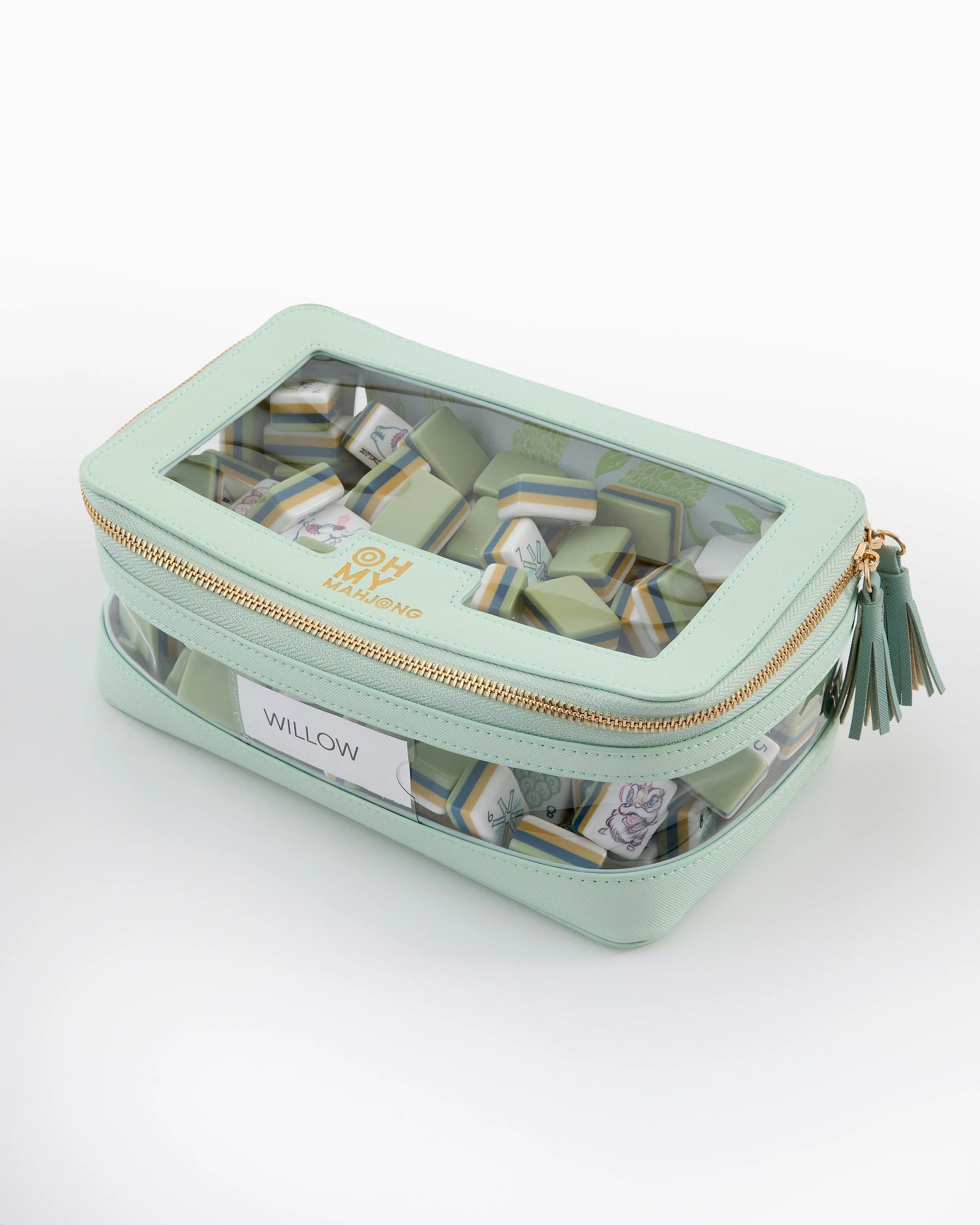 Mint green jewelry case with transparent lid on a white background