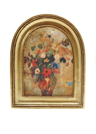 Collection of gold-framed pictures with various scenes on a white background