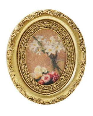 Collection of gold-framed pictures with various scenes on a white background