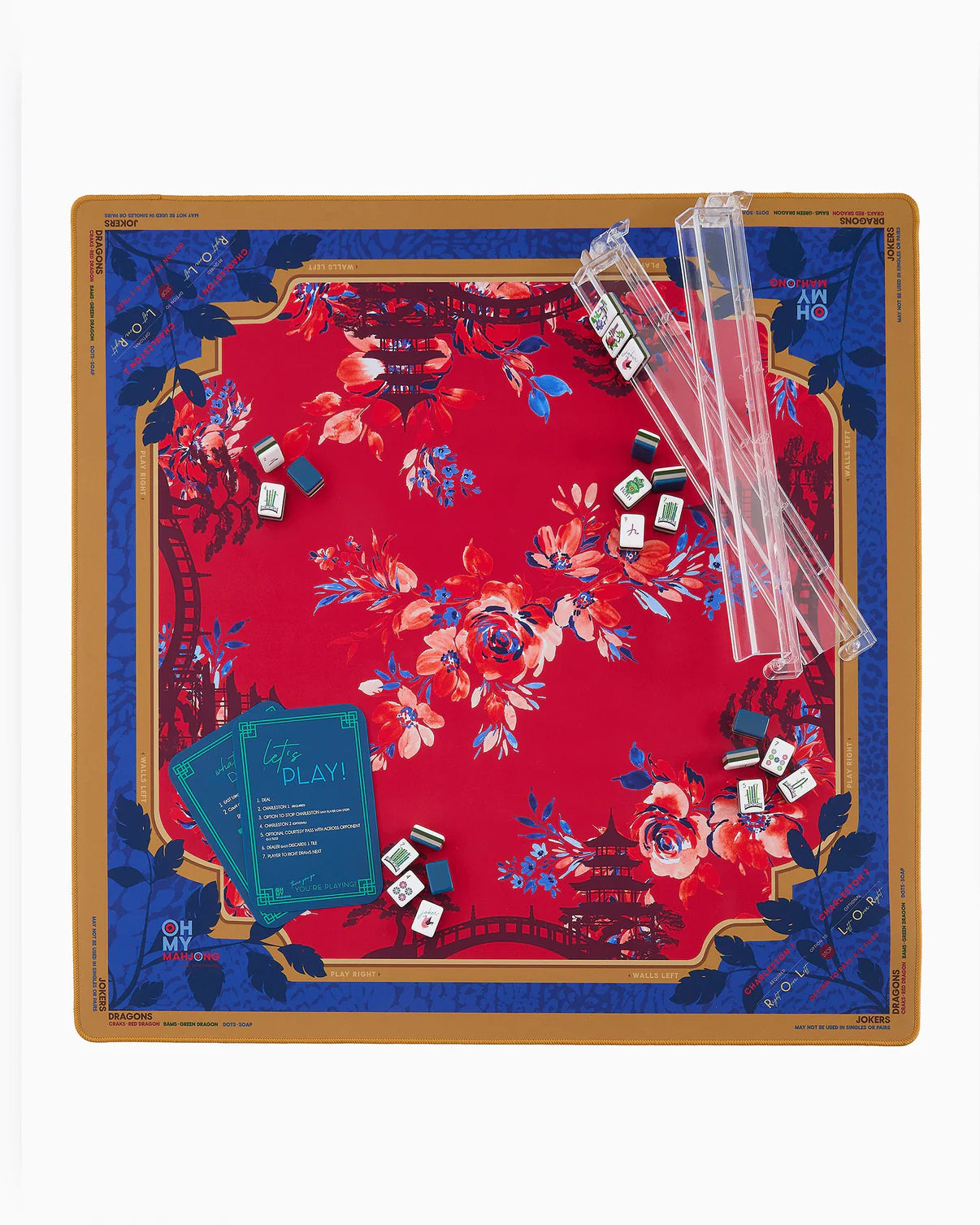 Decorative game board with floral design, dice, and cards on a white background