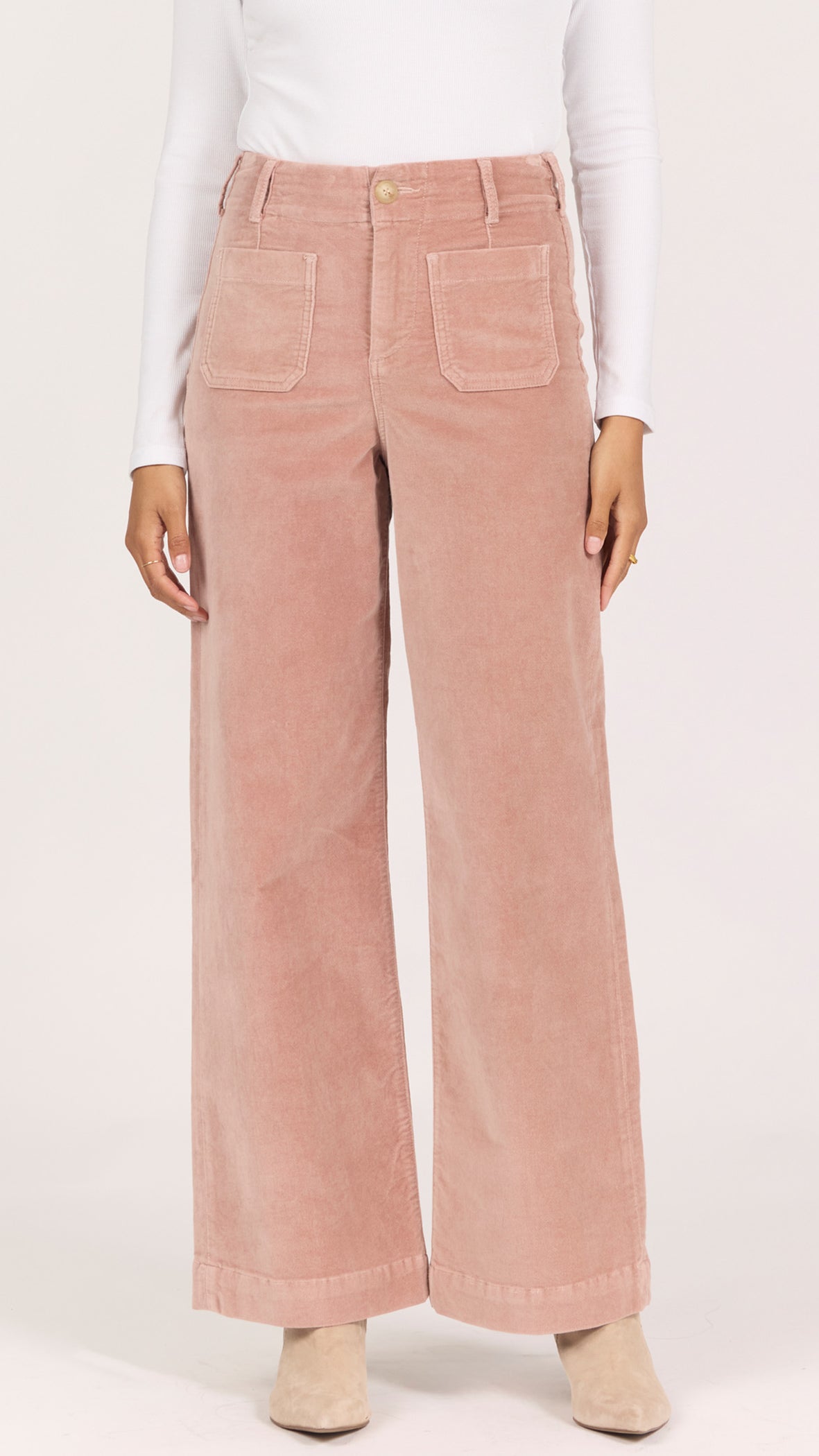 Front view of soft latte corduroy Audrey pants showing the front patch pockets, button closure and clean hem