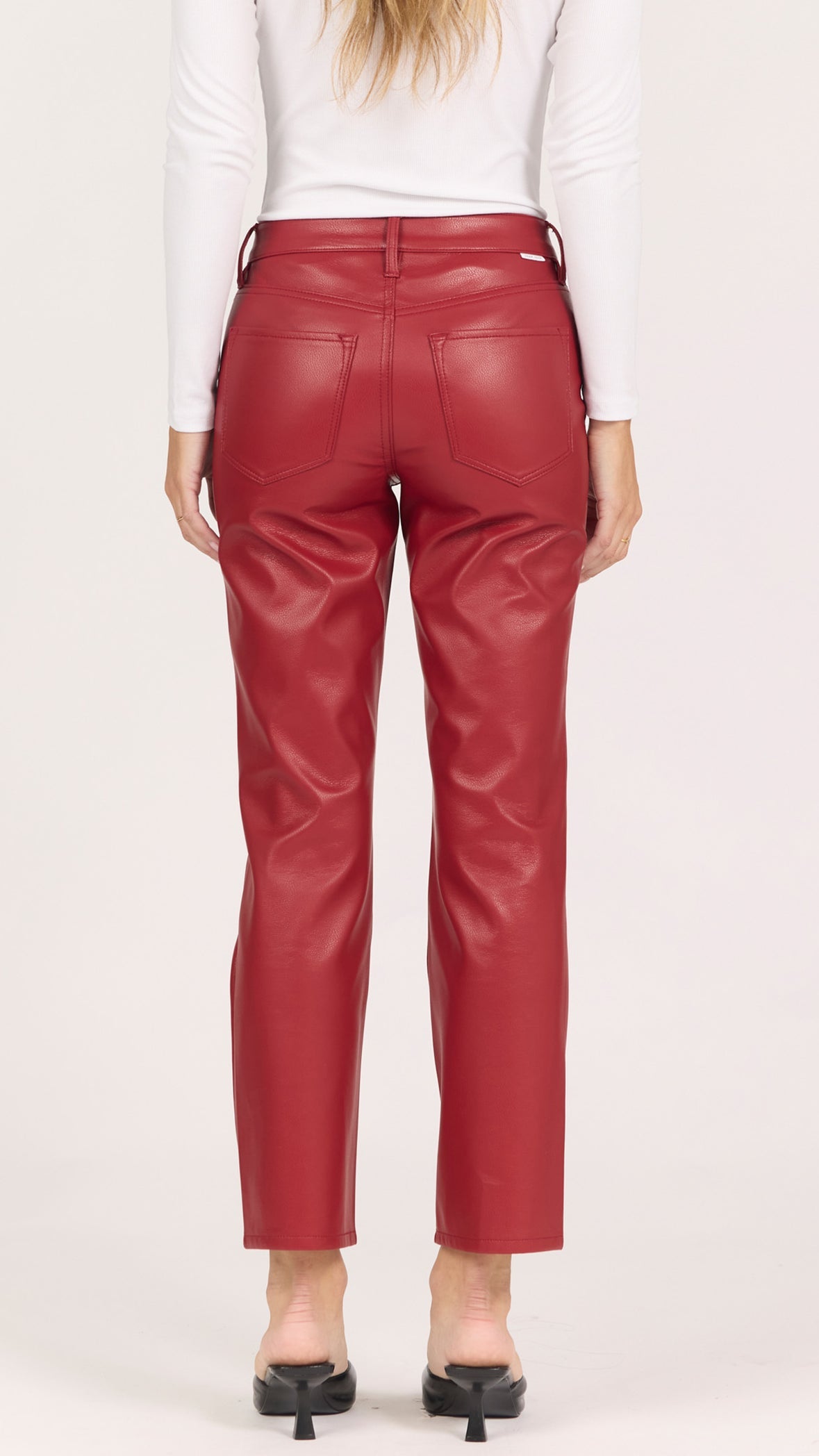 Back view of crimson lacquer faux leather Anika pants showing the back pockets