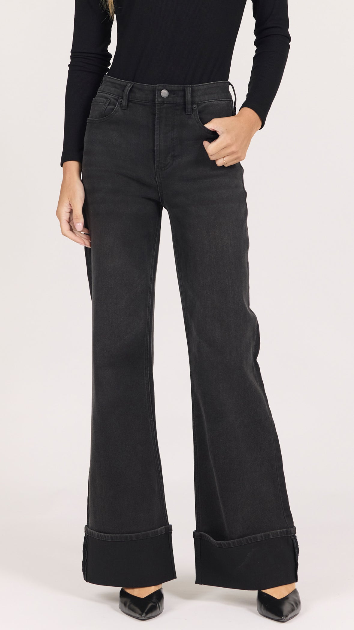 Front view of midnight washed black Fiona jeans showing the high rise and wide cuffed hem