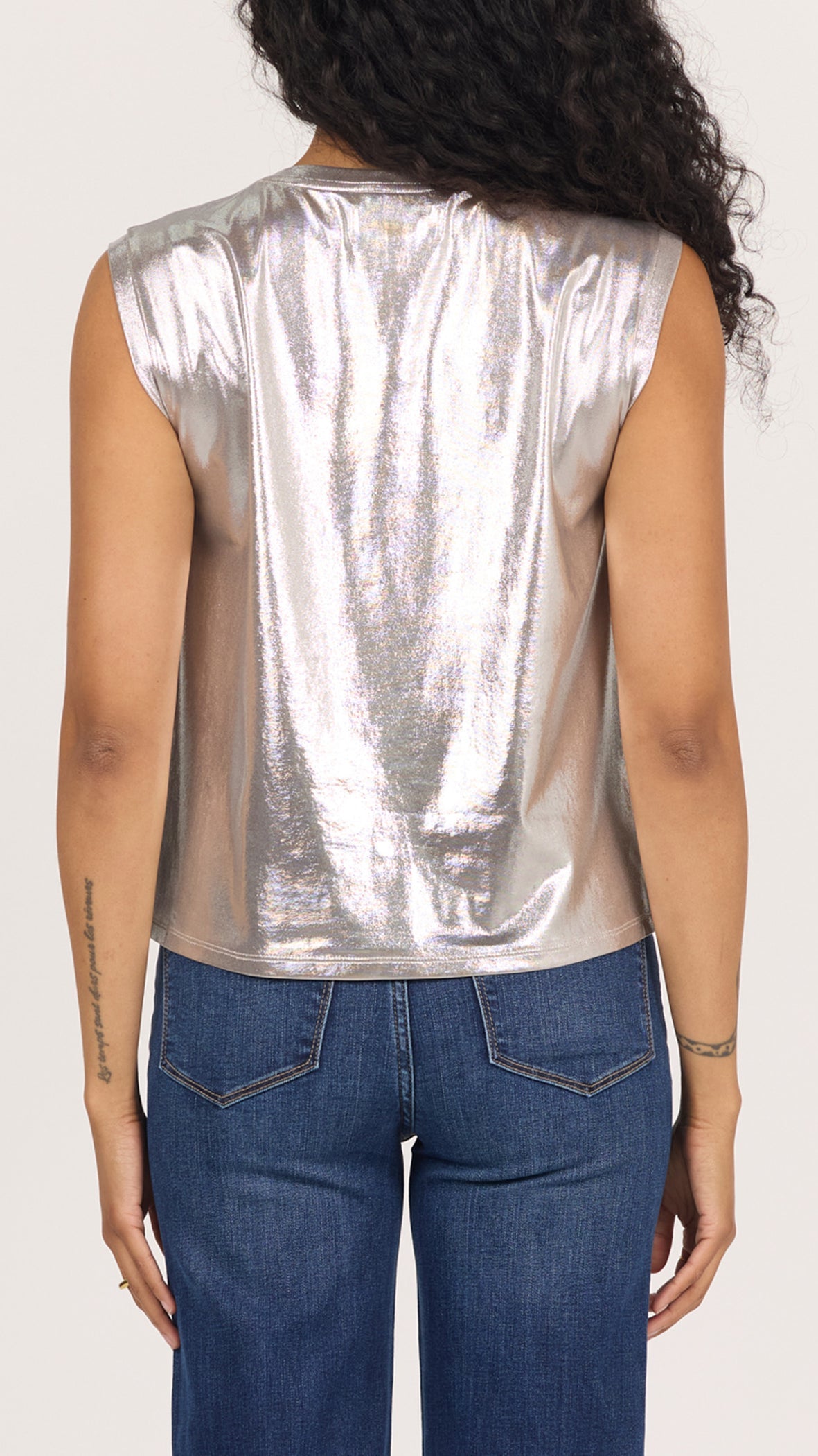 Back view of silver metallic Charli sleeveless muscle tee worn with dark wash jeans