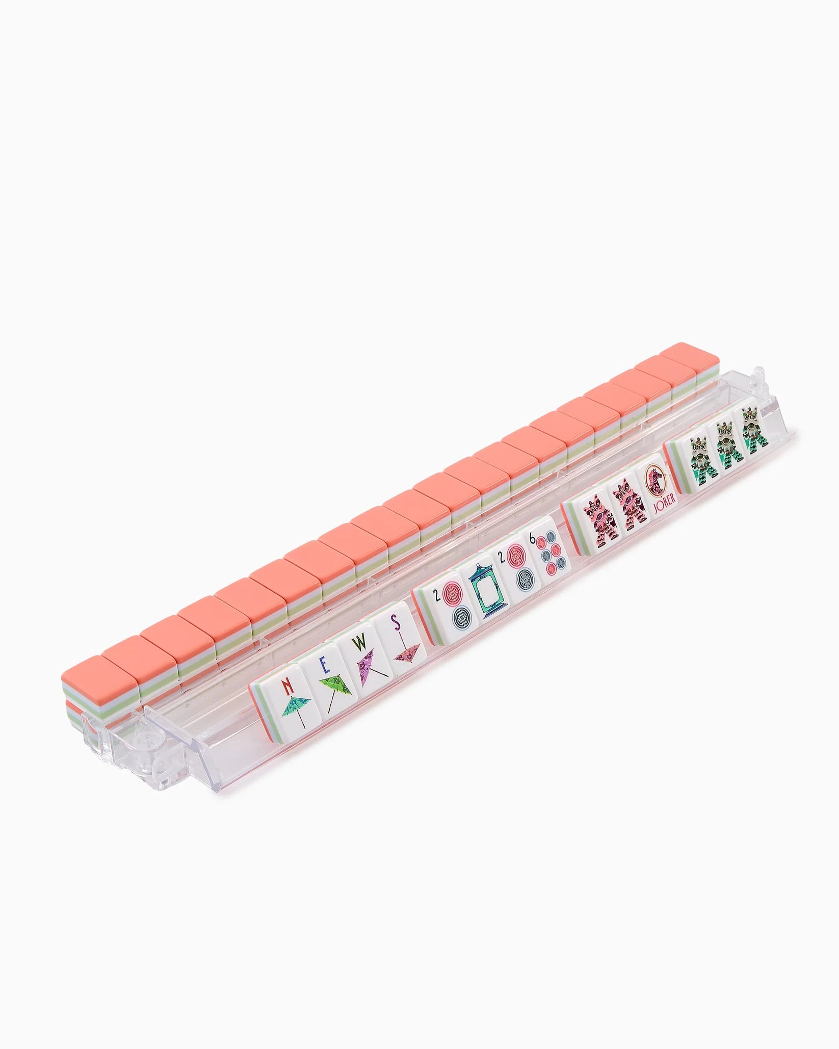 Set of pink and clear plastic tiles with colorful designs on a white background