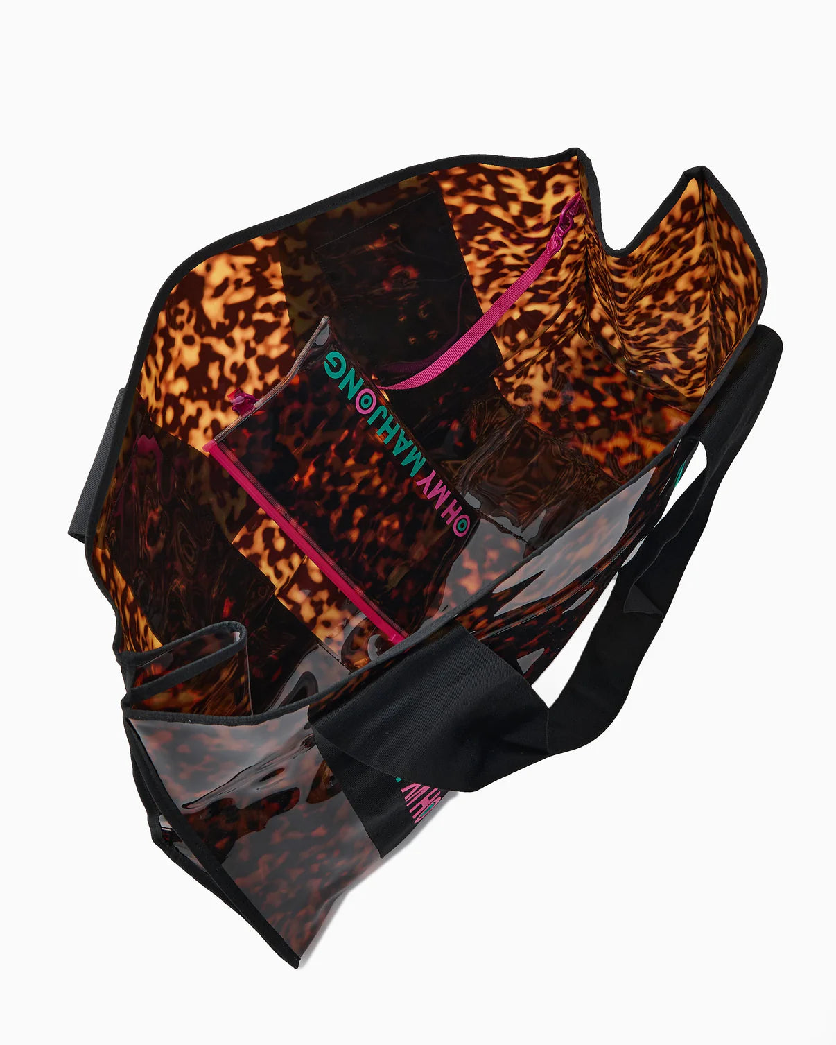 Clear handbag with leopard print accents and pink zipper on a white background