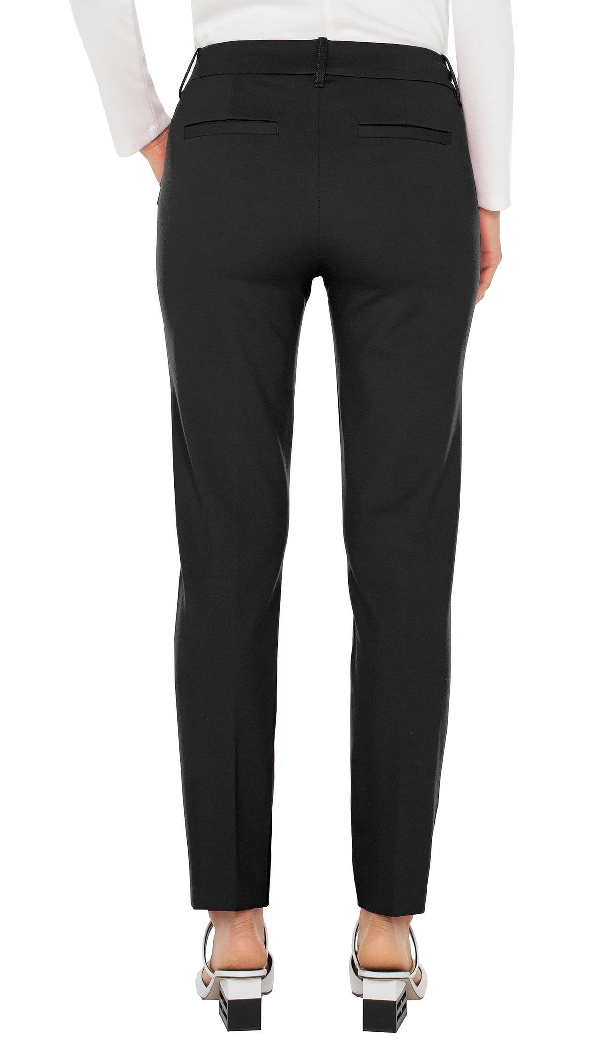 Back view of black Gemma cigarette trousers with white slingback heels