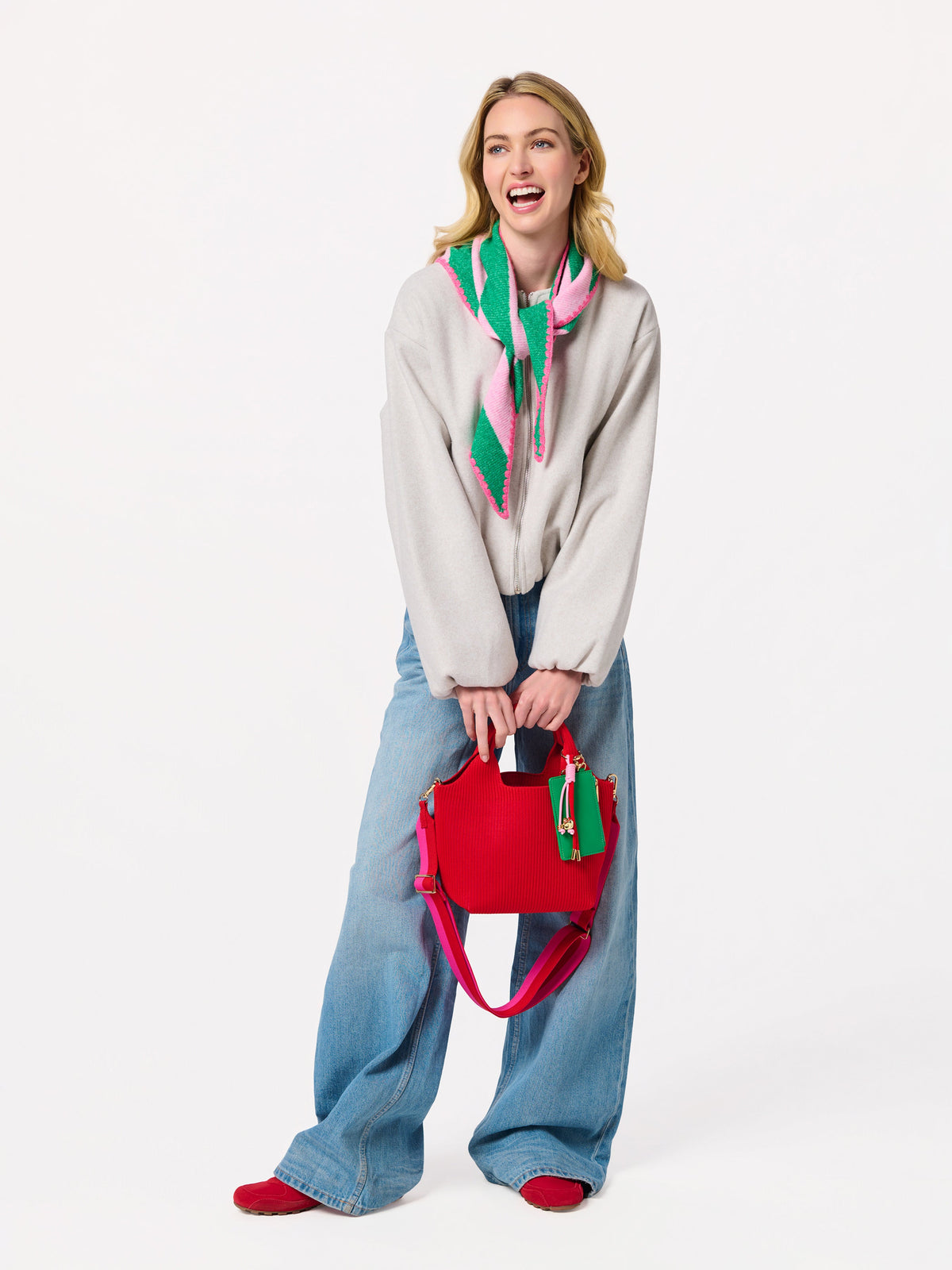 Shiraleah Joy Small Triangle Scarf in green and pink stripes, acrylic, polyester and wool knit, full-length outfit on model, lifestyle view