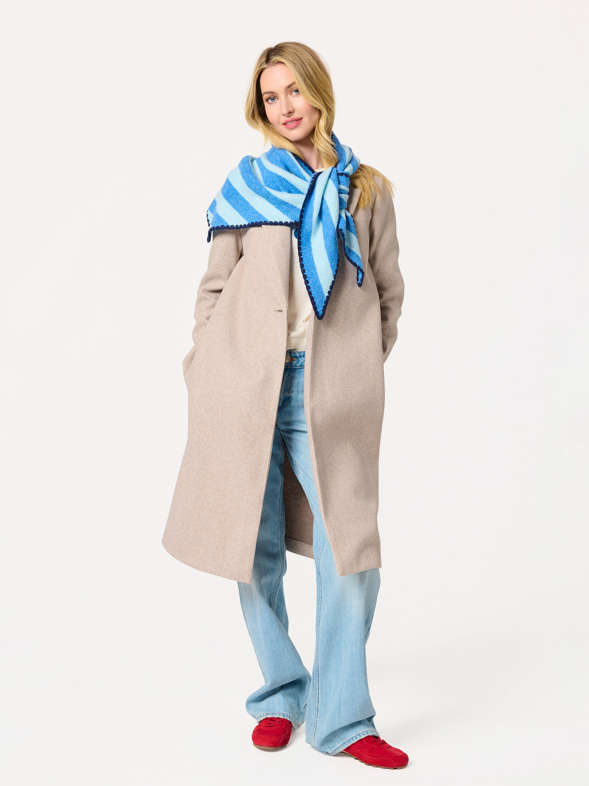 Shiraleah Joy Large Triangle Scarf in blue and light blue stripes, acrylic, polyester and wool knit, full-length outfit on model, lifestyle view