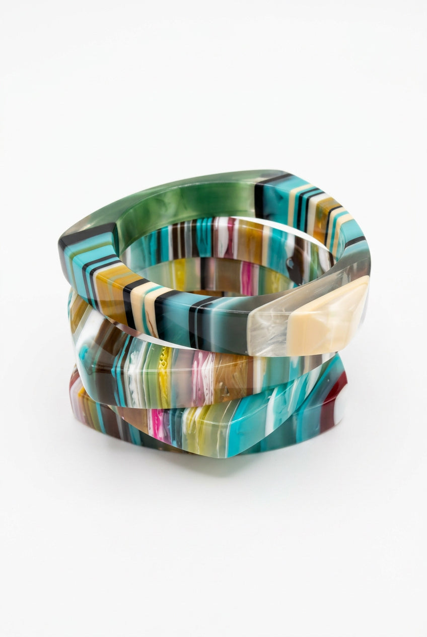 Triangle multicolor resin bangle bracelets in teal, green, cream and pink stripes, stacked view.