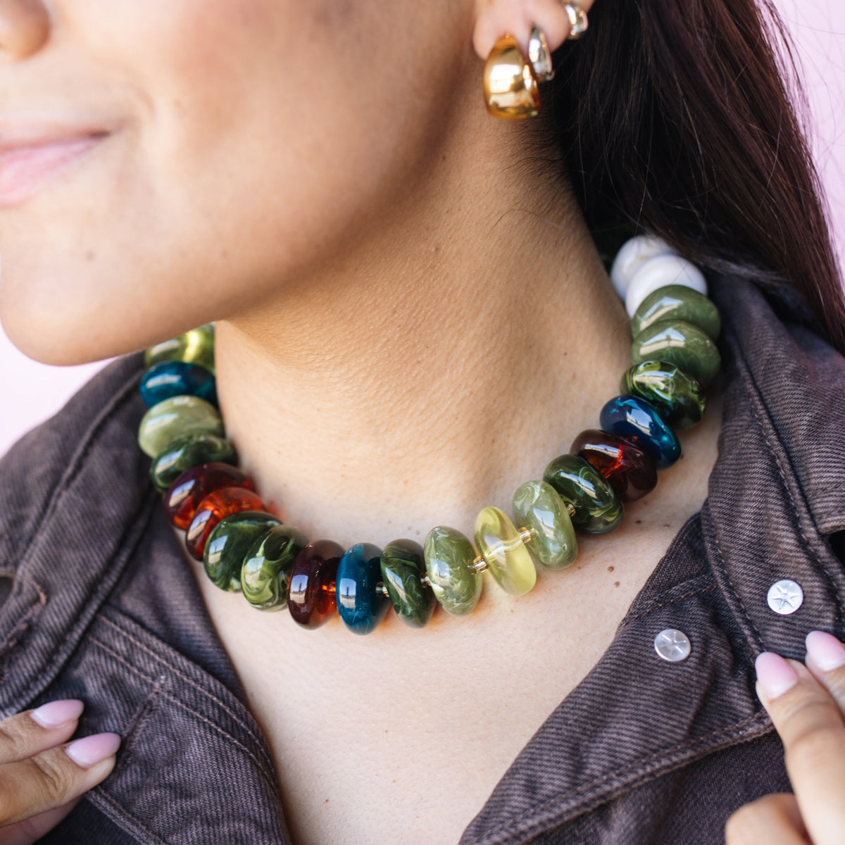 Model wearing The Icon Necklace in olive and amber