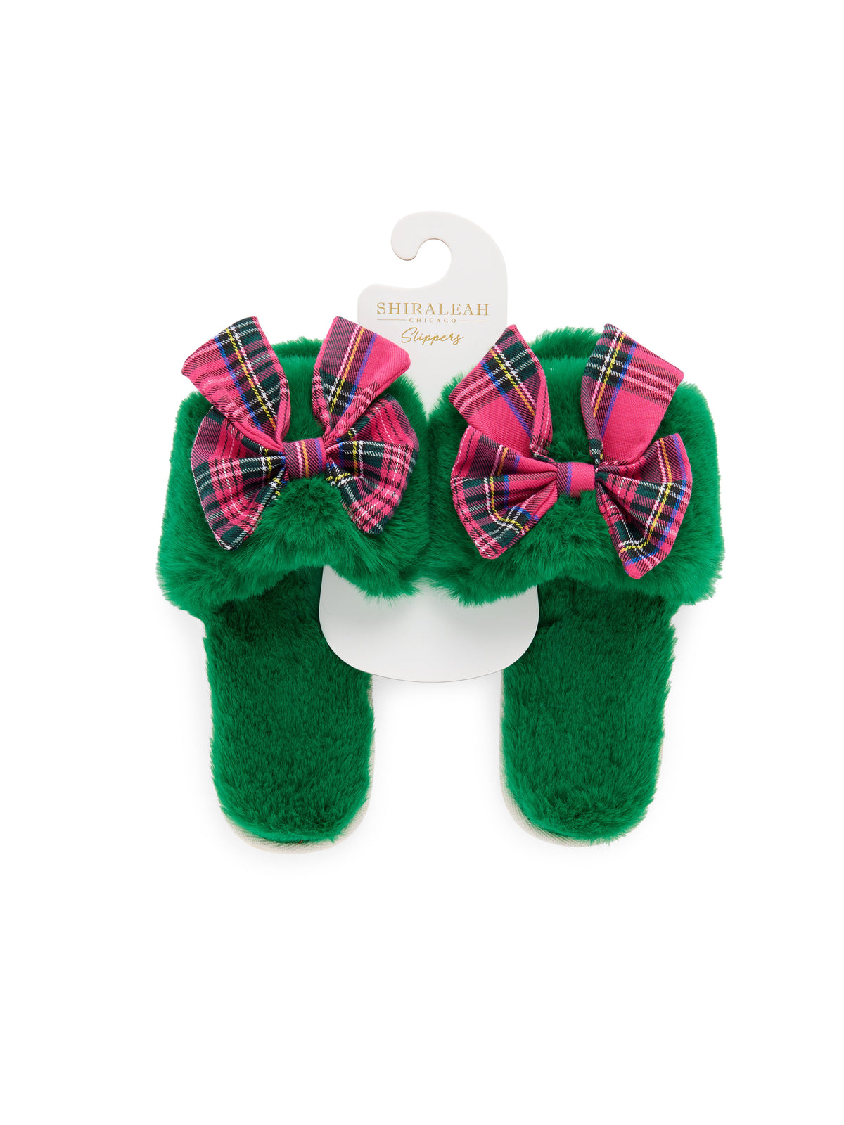 Shiraleah Scottie Slippers in green faux fur with pink and red tartan bows, polyester and PVC, pair on hanger, packaging view