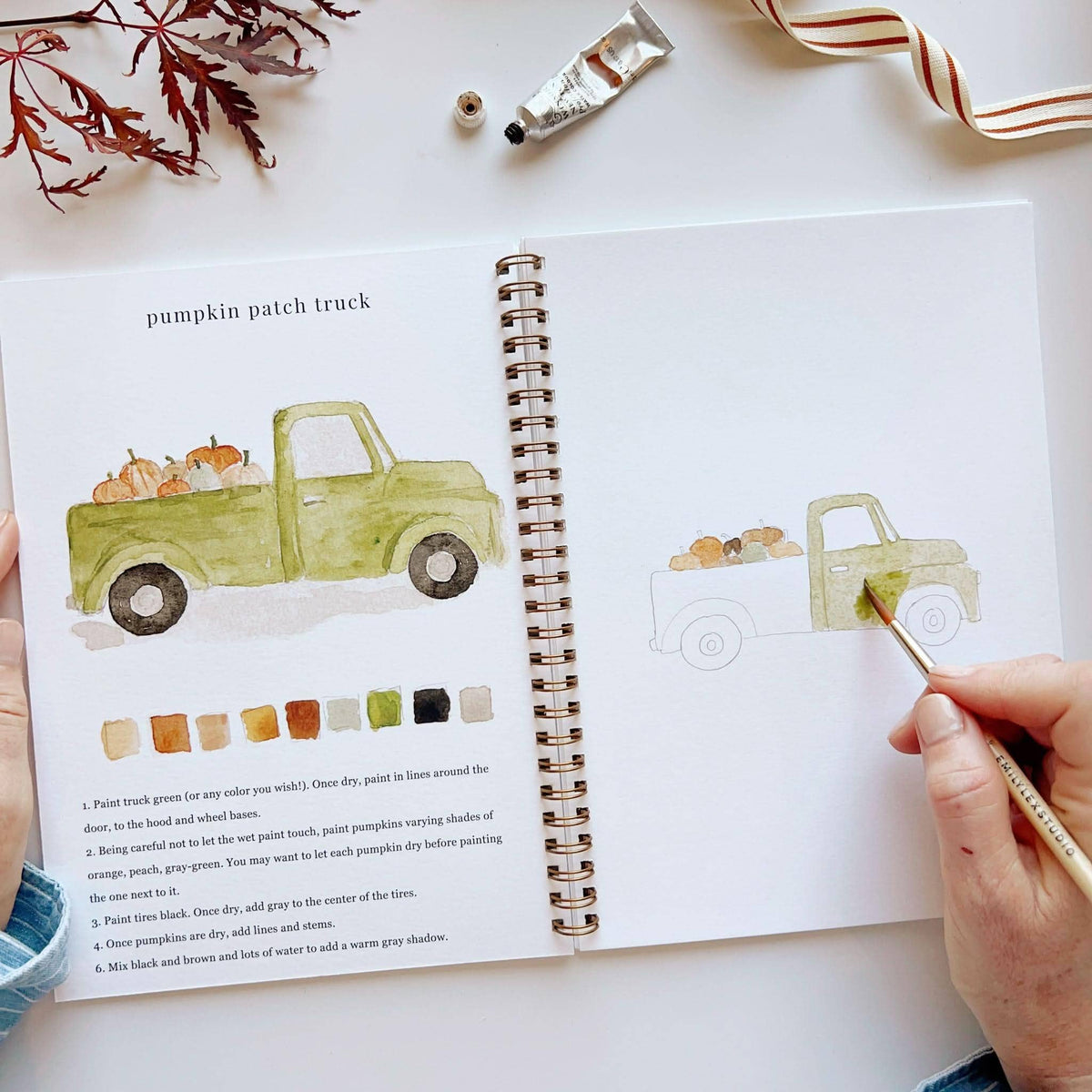 Painting a green vintage truck in the autumn watercolor workbook